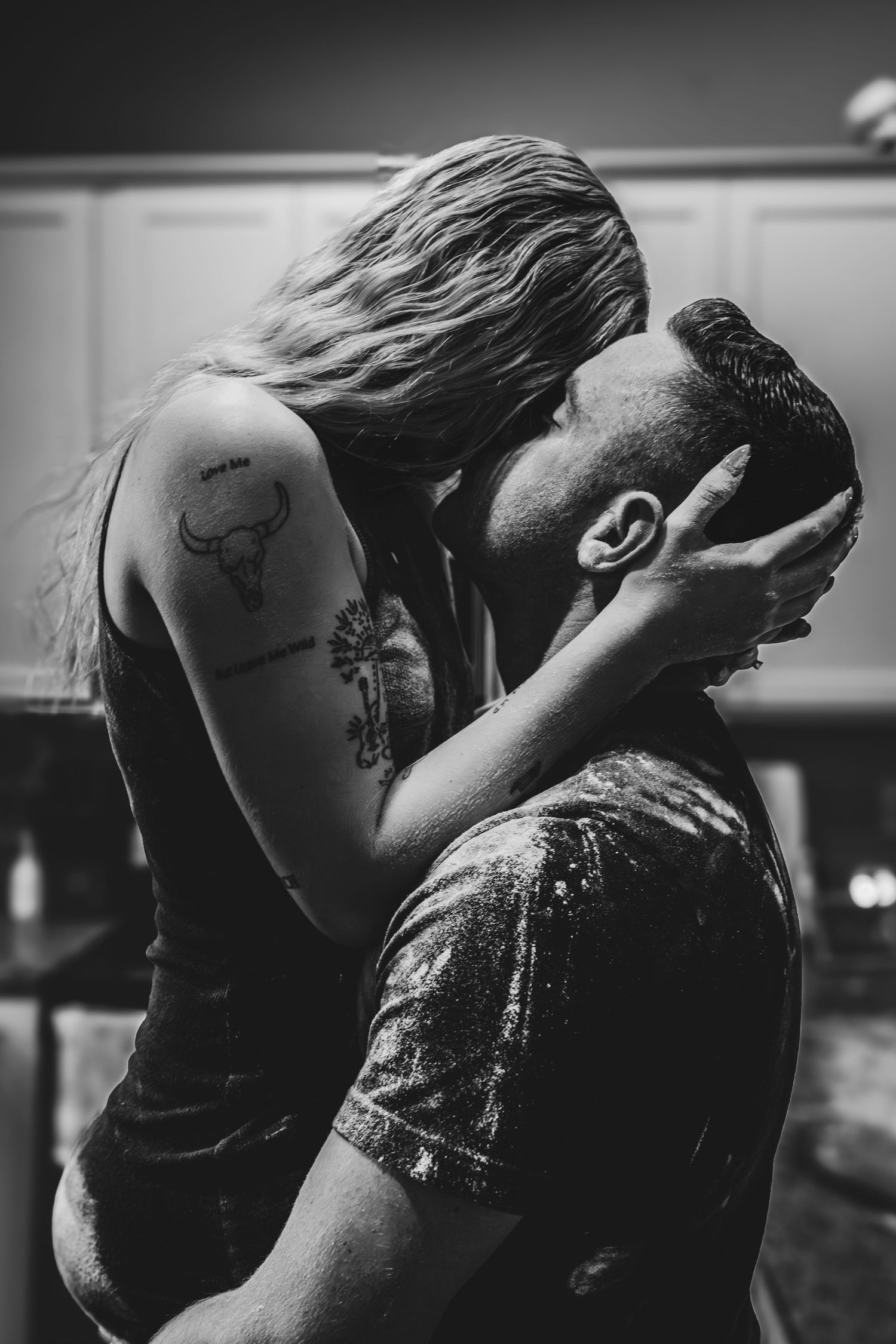 Artistic black and white photo sequence showing intimate couple embracing in dramatic shadows.