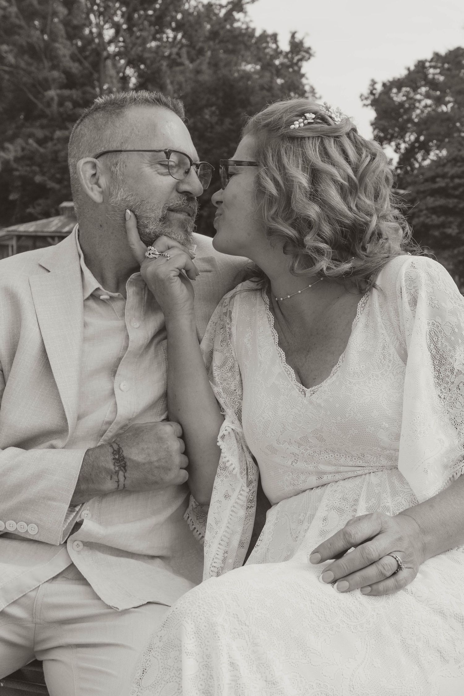 couple sitting on a bench after vow renewal ceremony