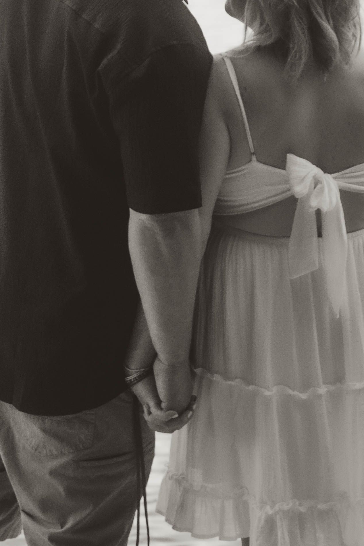 bride and groom holding hands
