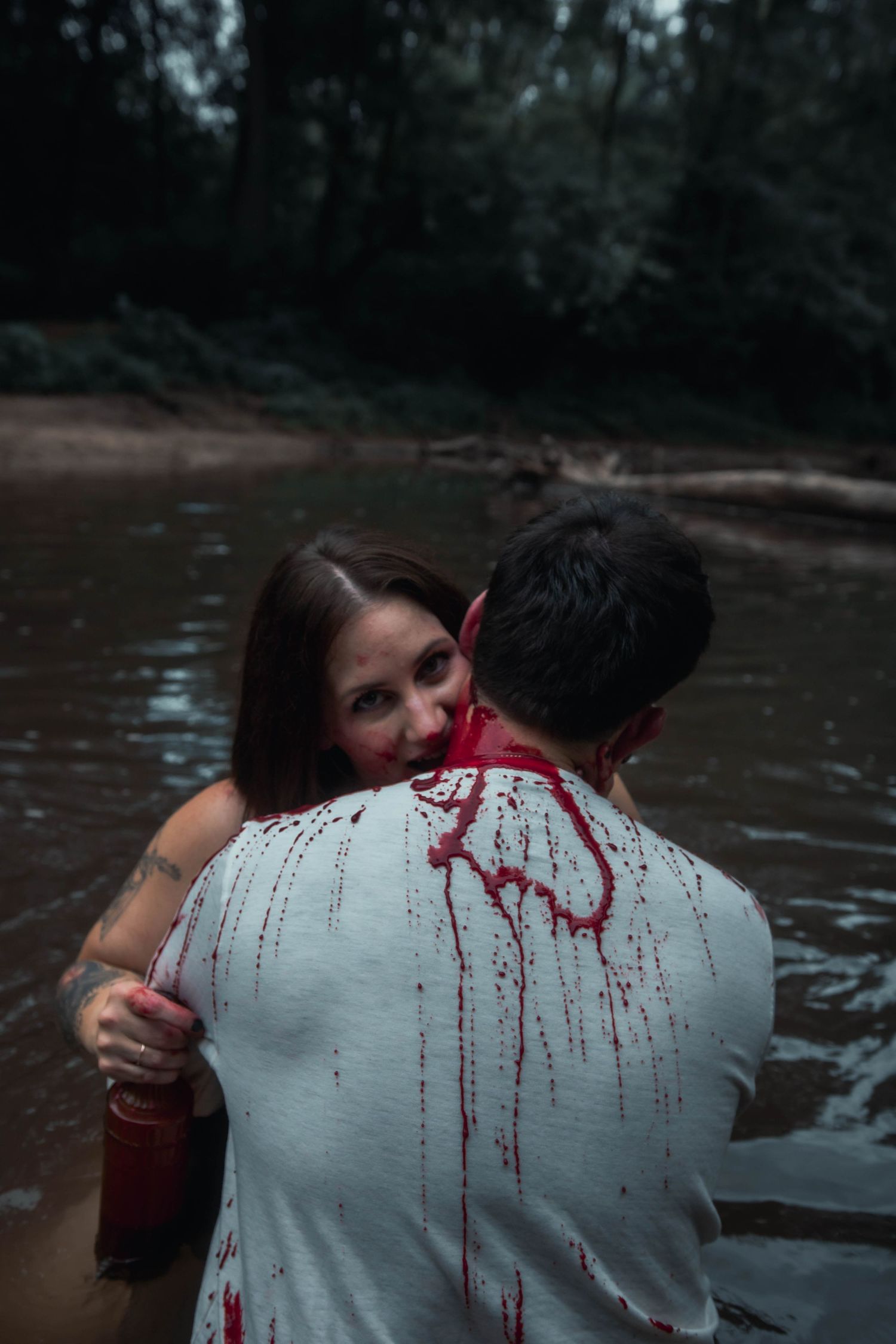 couples bloody vampire in a river
