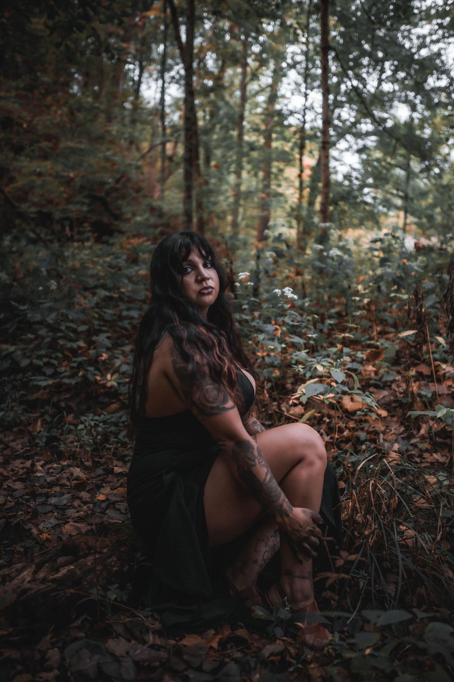 moody woman in woods