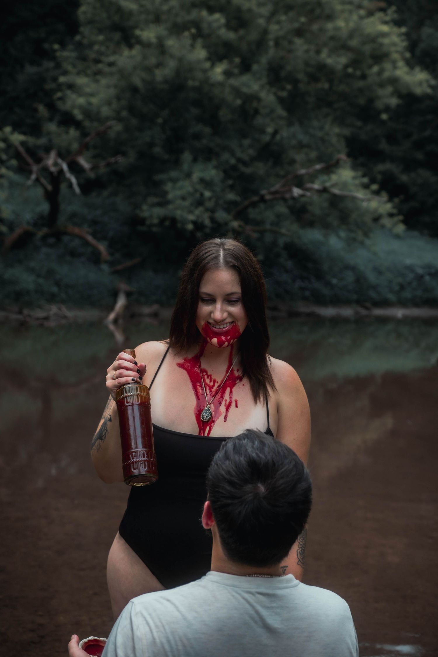 couples bloody vampire in a river