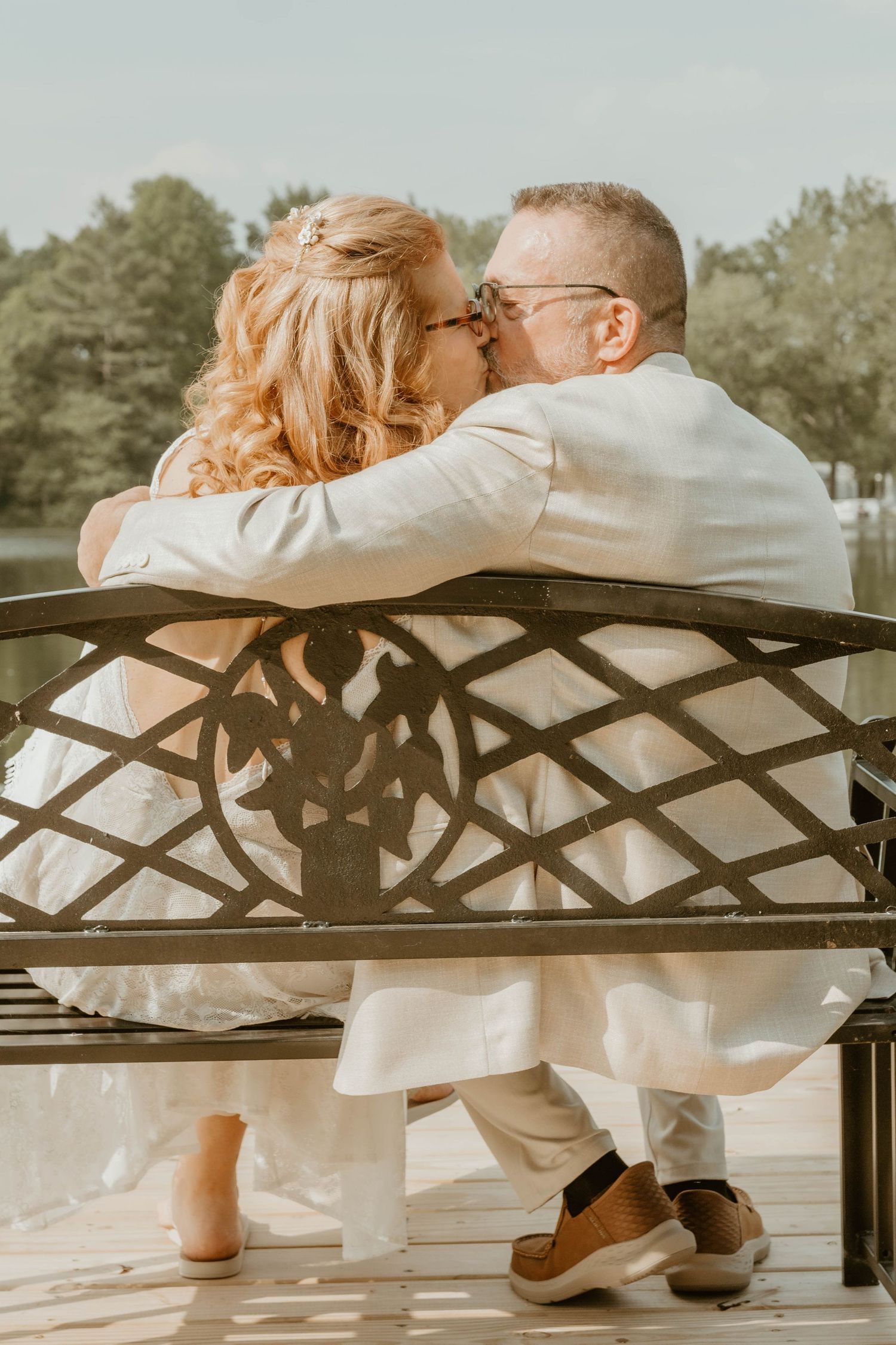 couple sitting on a bench after vow renewal ceremony