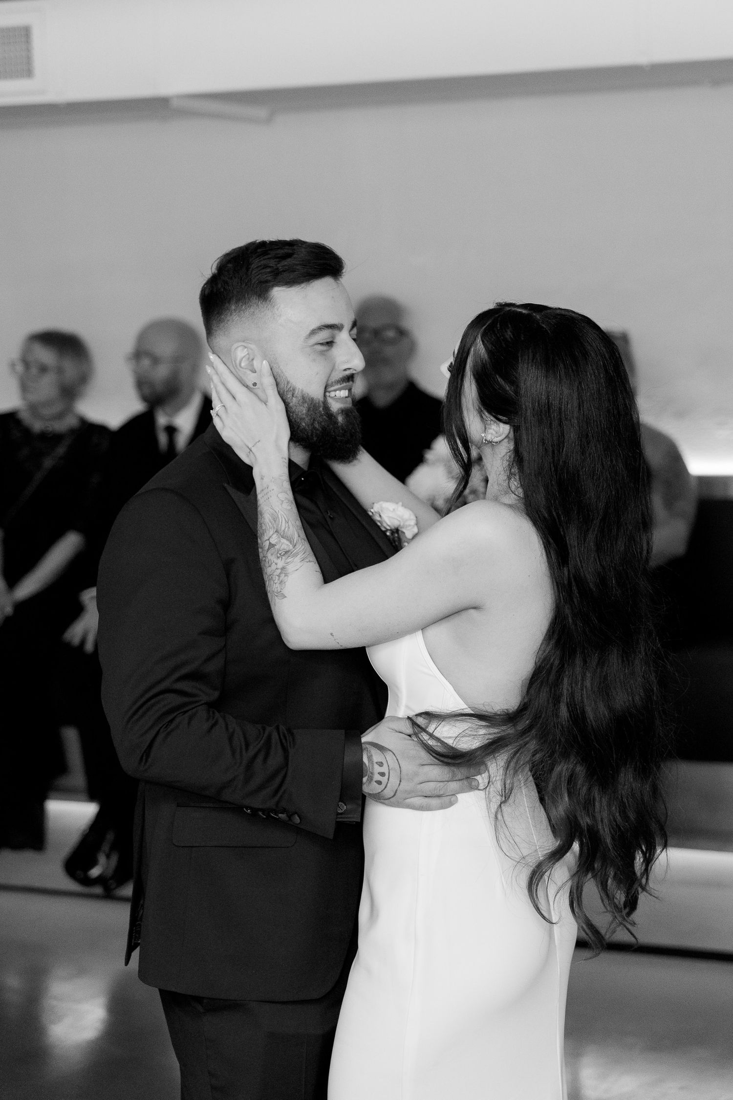 Graceful dance moves captured in black and white as couples take to the dance floor at a formal event.