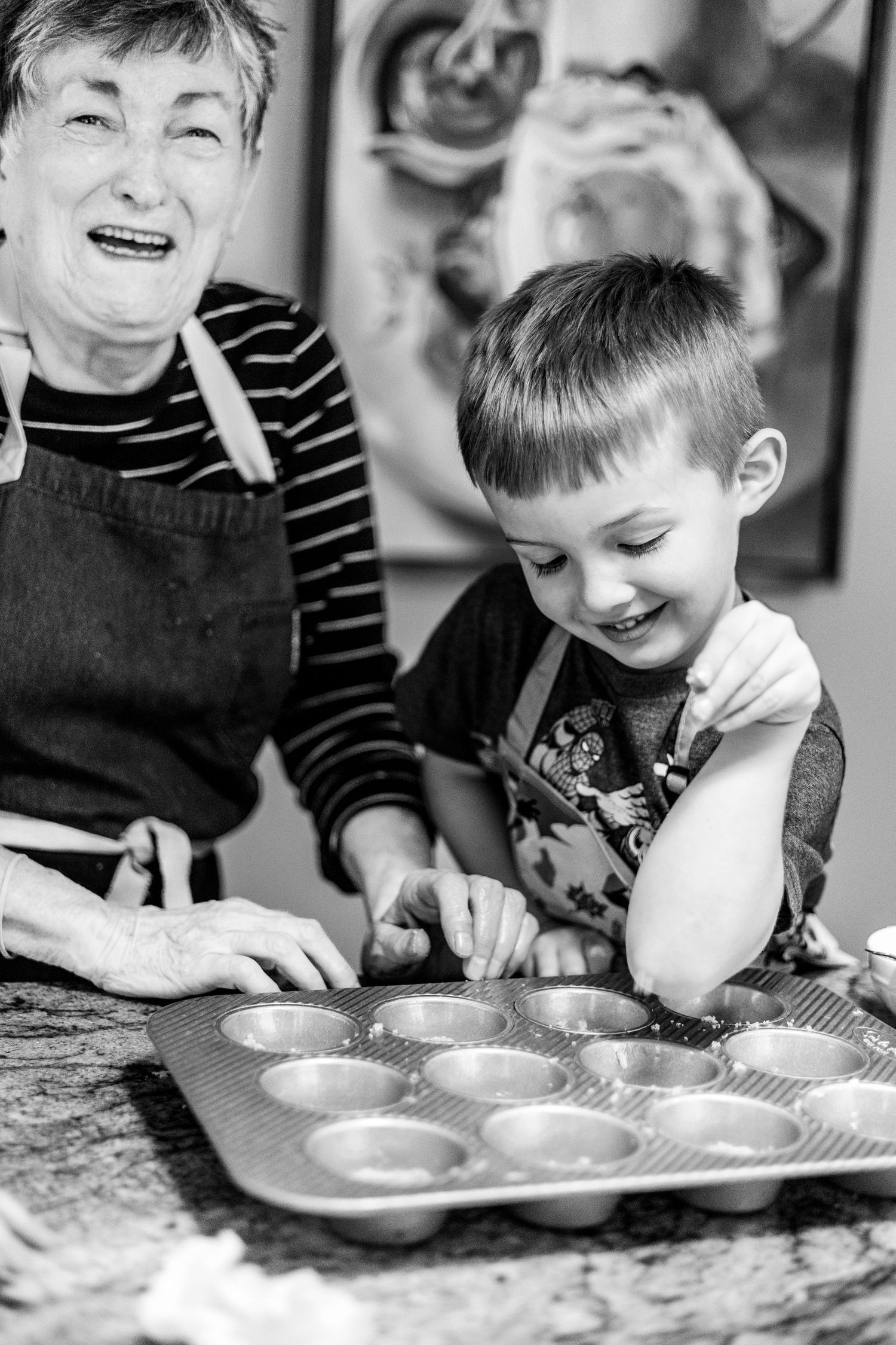 A series of black and white photos showing a child and adult baking together in the kitchen.