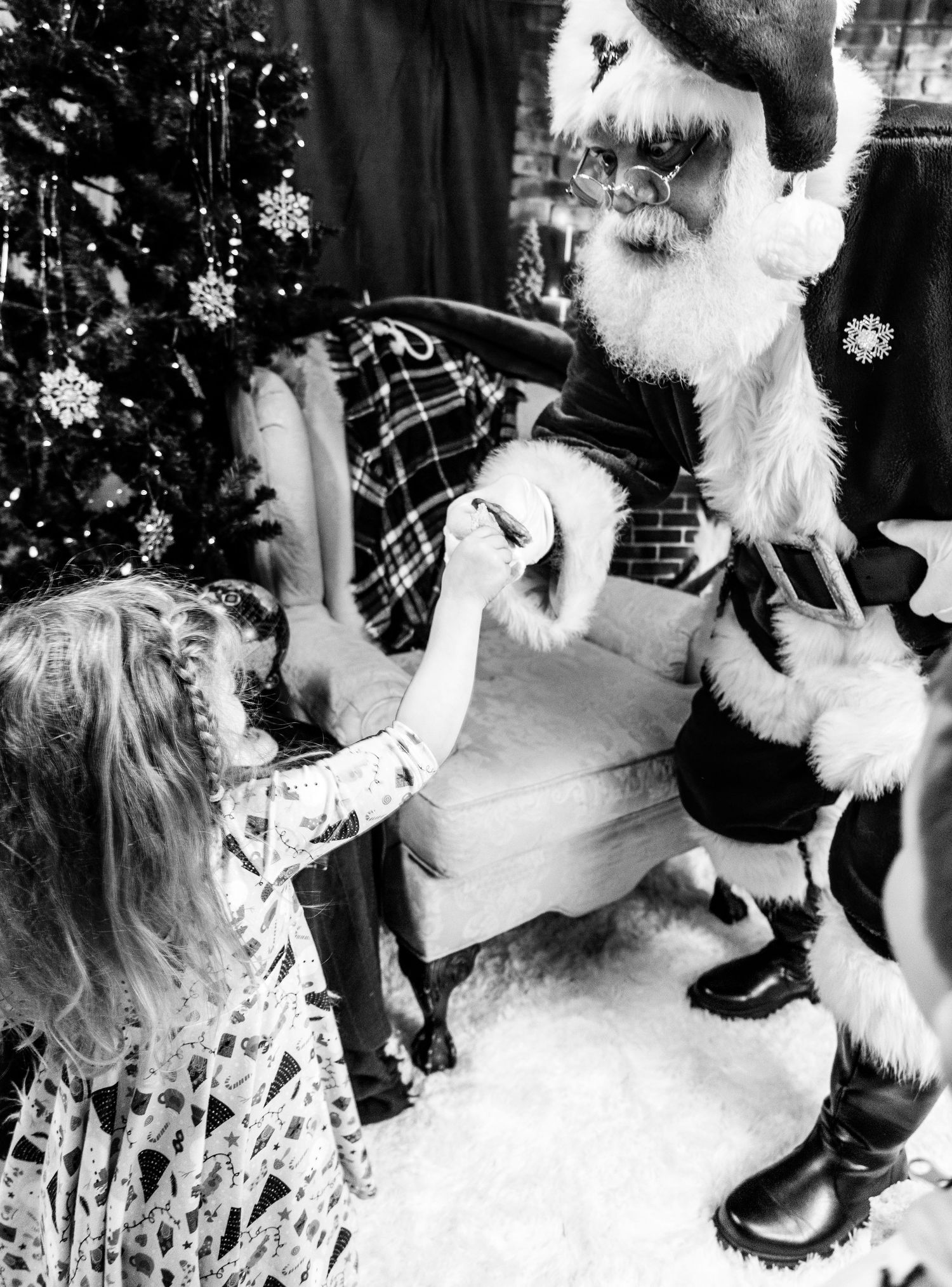 Black and white photo sequence showing holiday decorations and a white fluffy dog during Christmas festivities.
