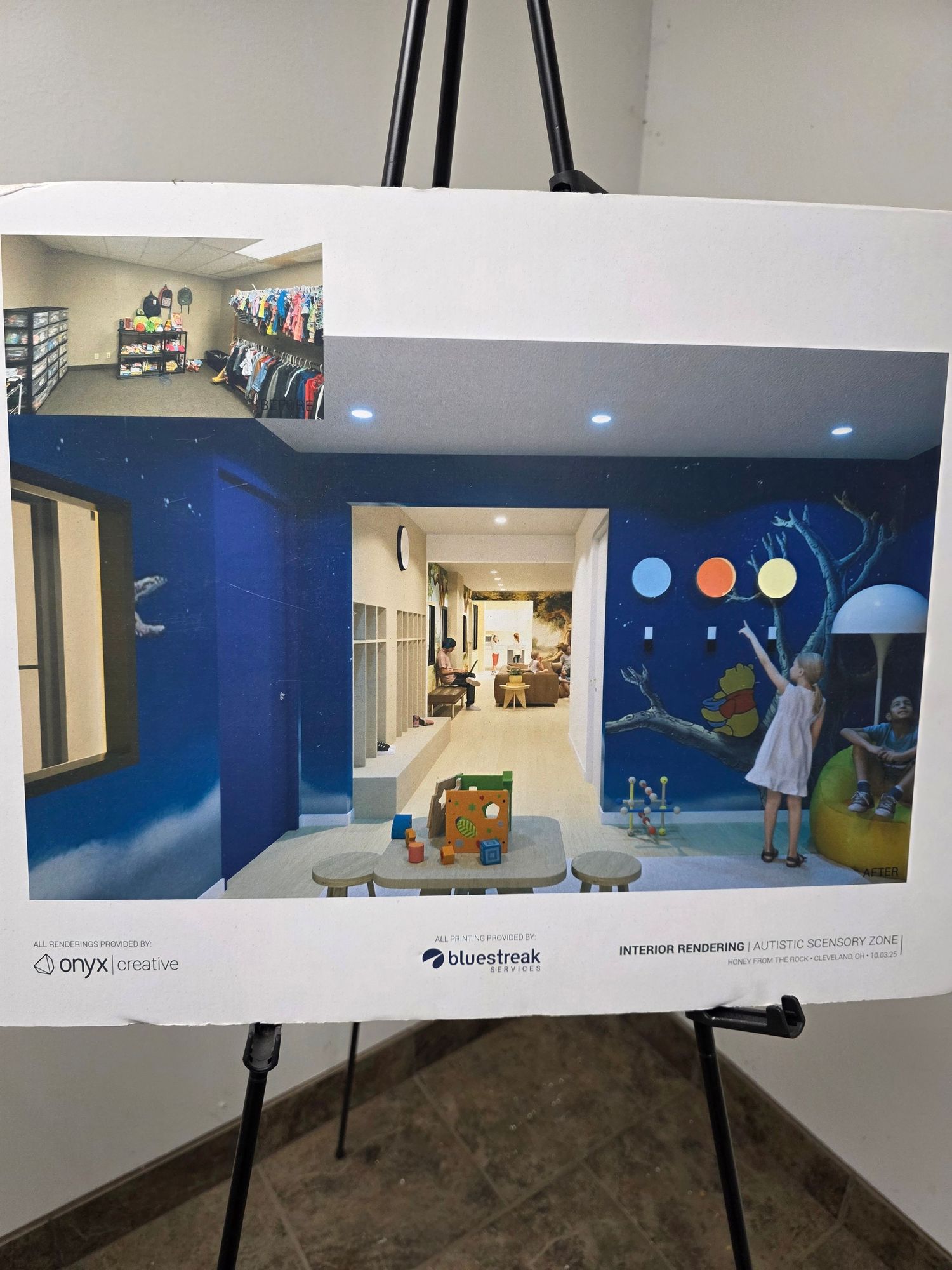 Interior rendering of an autism sensory zone displayed on an easel, featuring colorful murals, play areas, and soft lighting design.