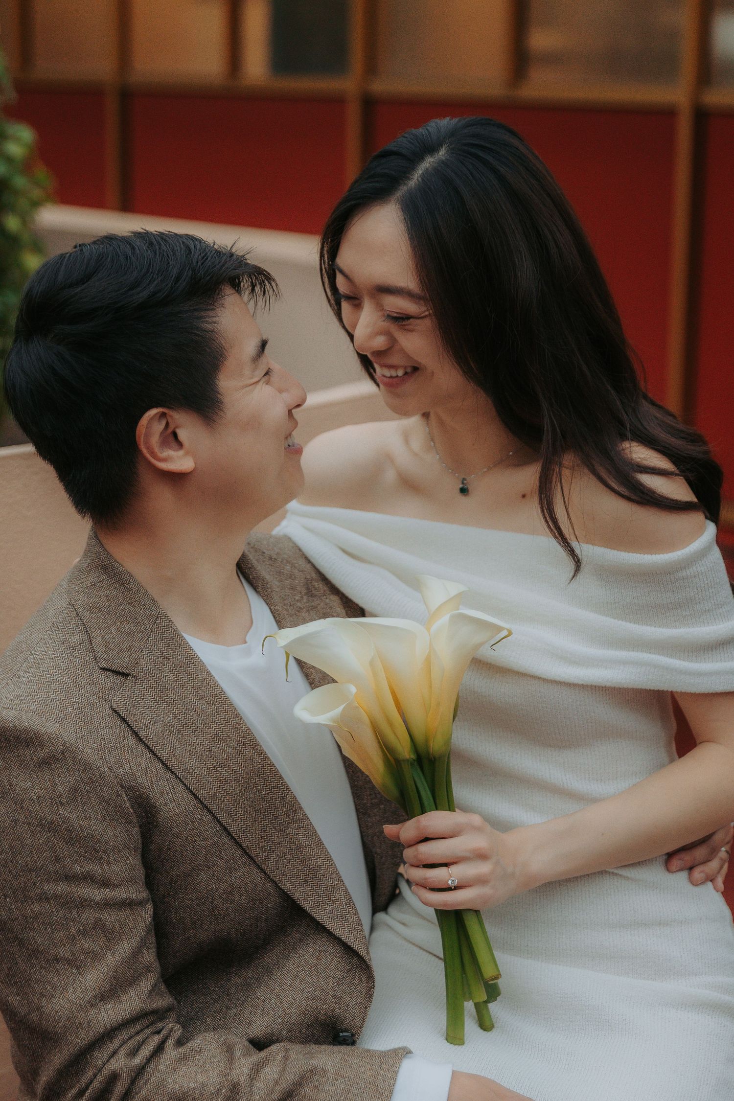 A romantic couple shares tender moments in a series of intimate photos while holding yellow tulips.