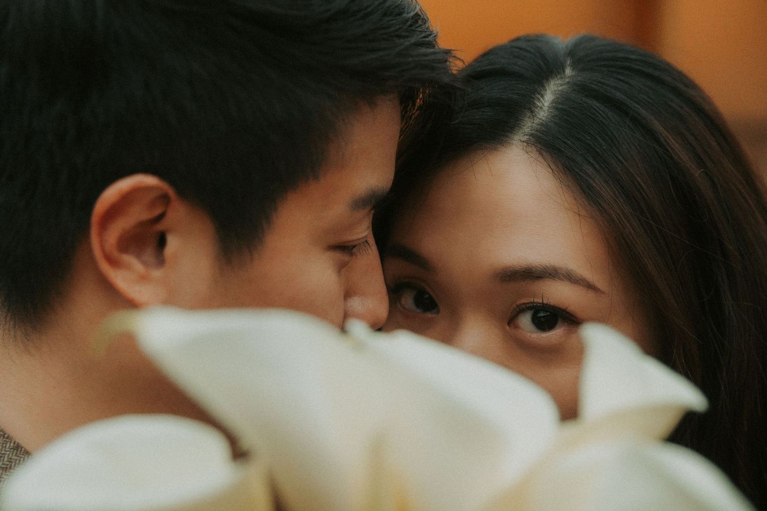 A series of photos showing tender kisses and intimate moments between couples in a romantic montage.