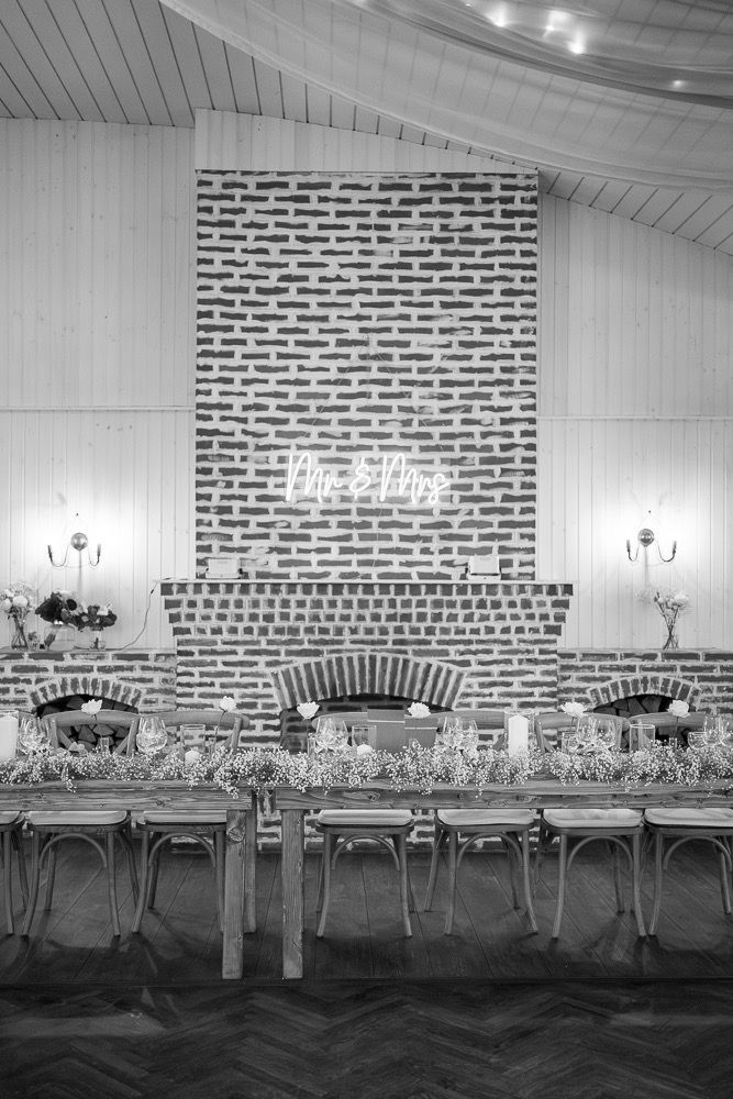 Four black and white images showing metal chairs against a brick wall in a progressive sequence.