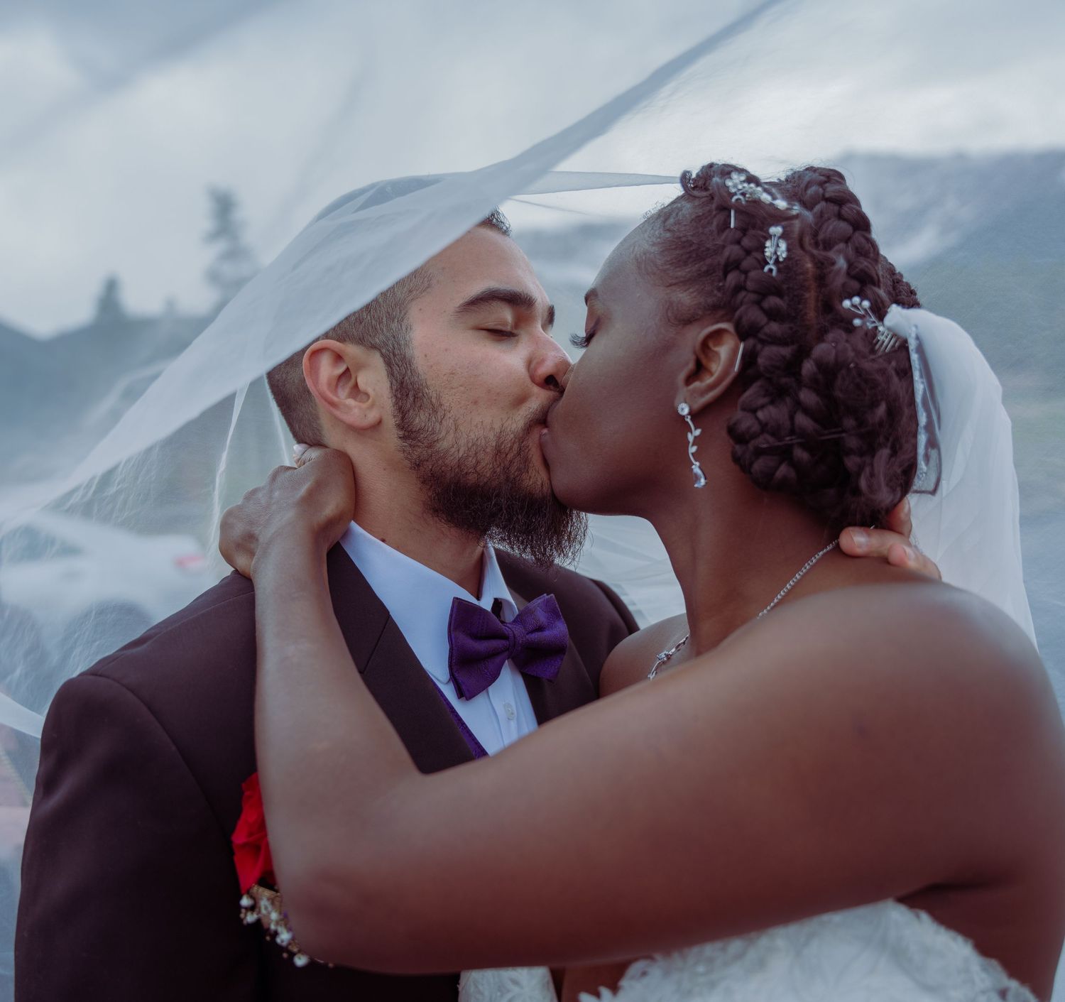 A romantic wedding photo collage showing intimate kisses between newlyweds against a cloudy outdoor backdrop.