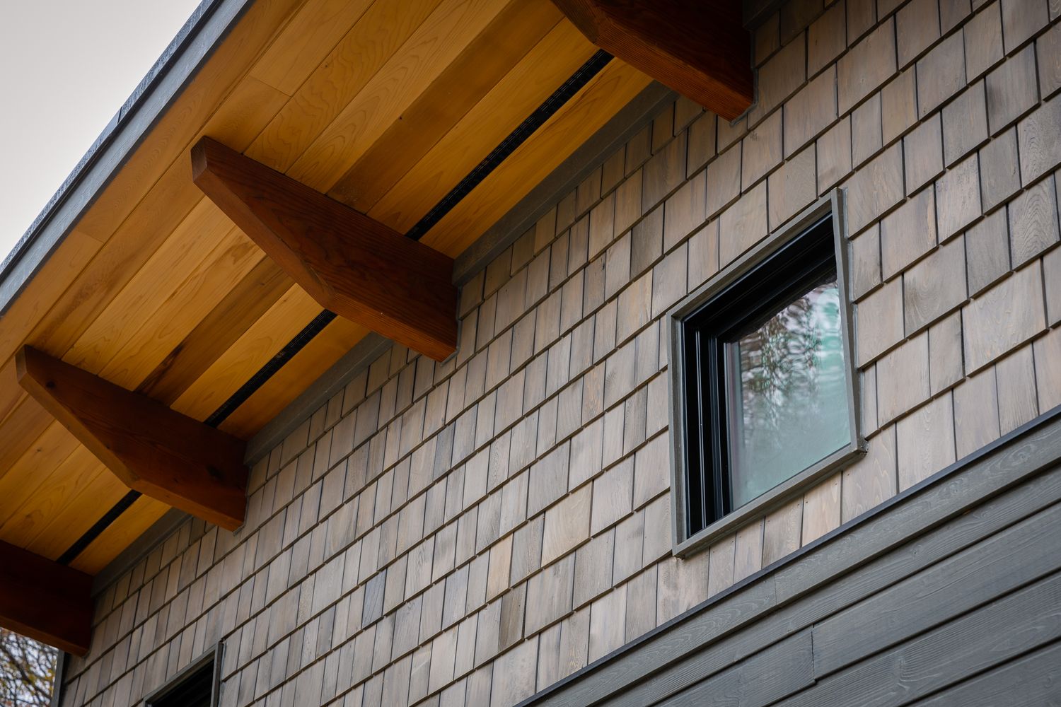 The house has cedar shake siding and cedar soffit.
