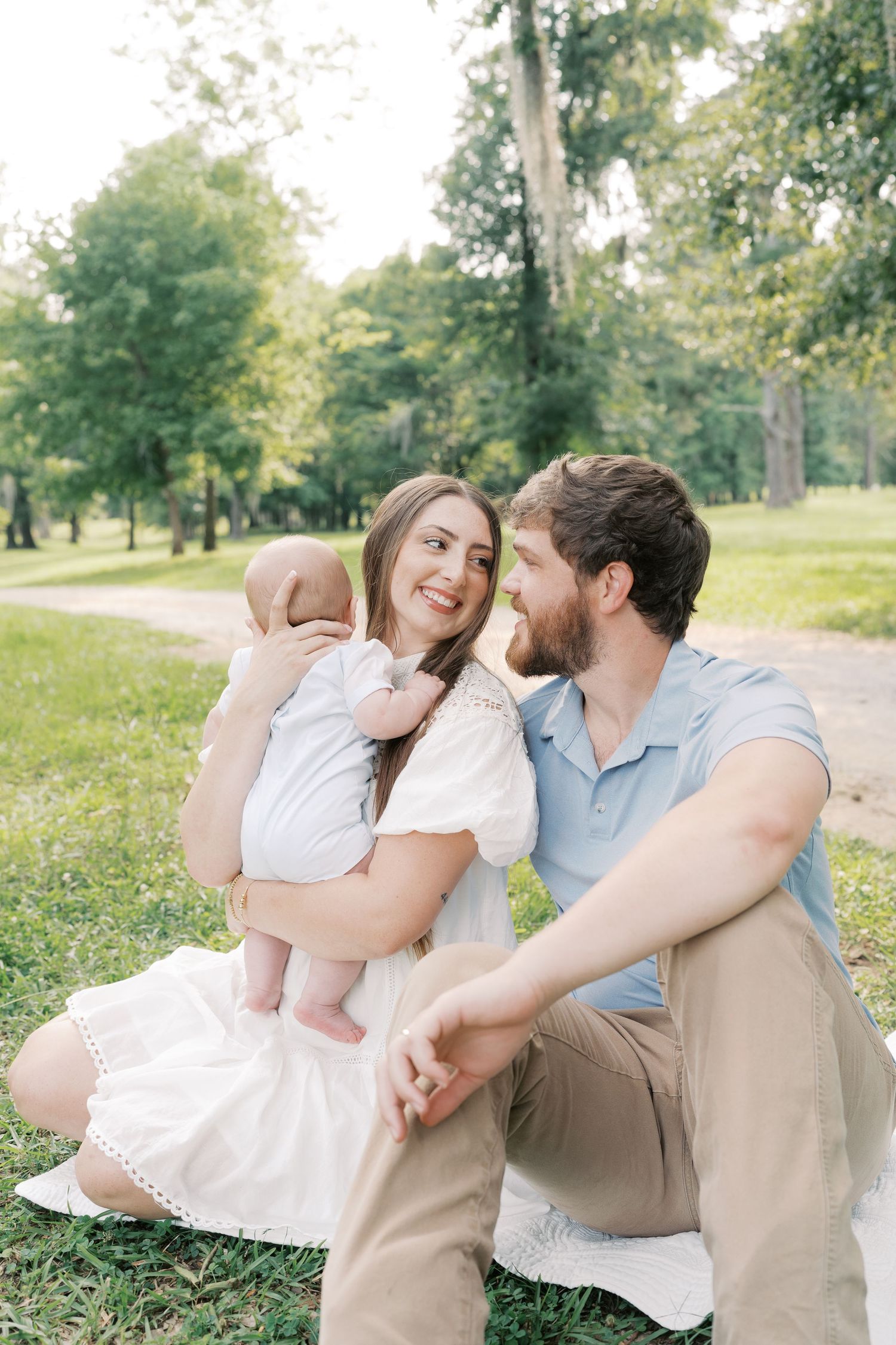 Tender family interactions captured in a series of candid outdoor photos in a park setting.