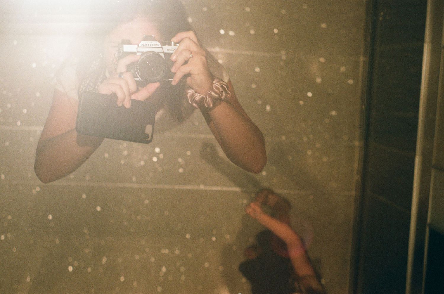 Blurred motion photograph with sparkly light effects in a dark setting.
