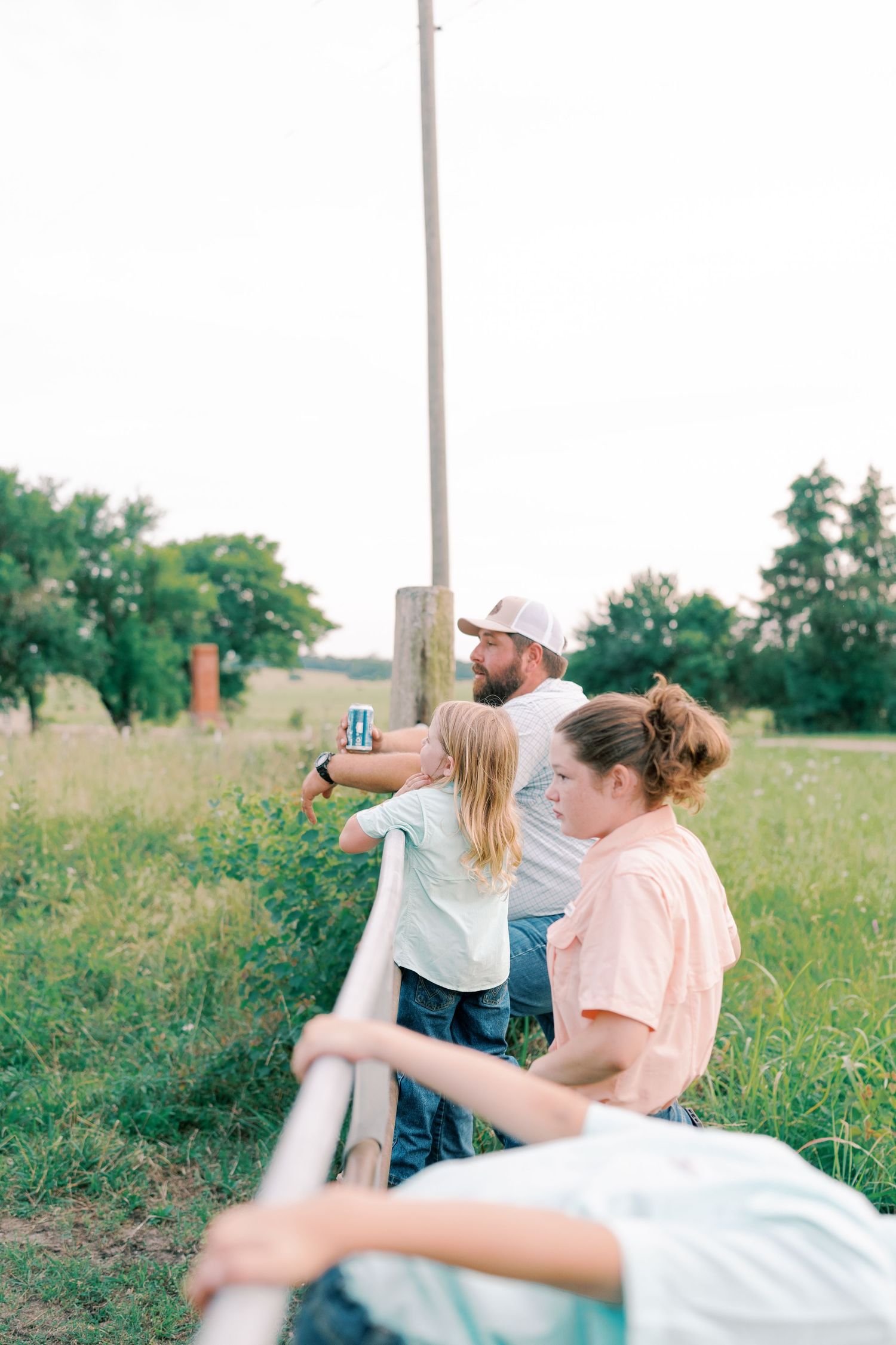 People enjoying playful moments together in a summer field.