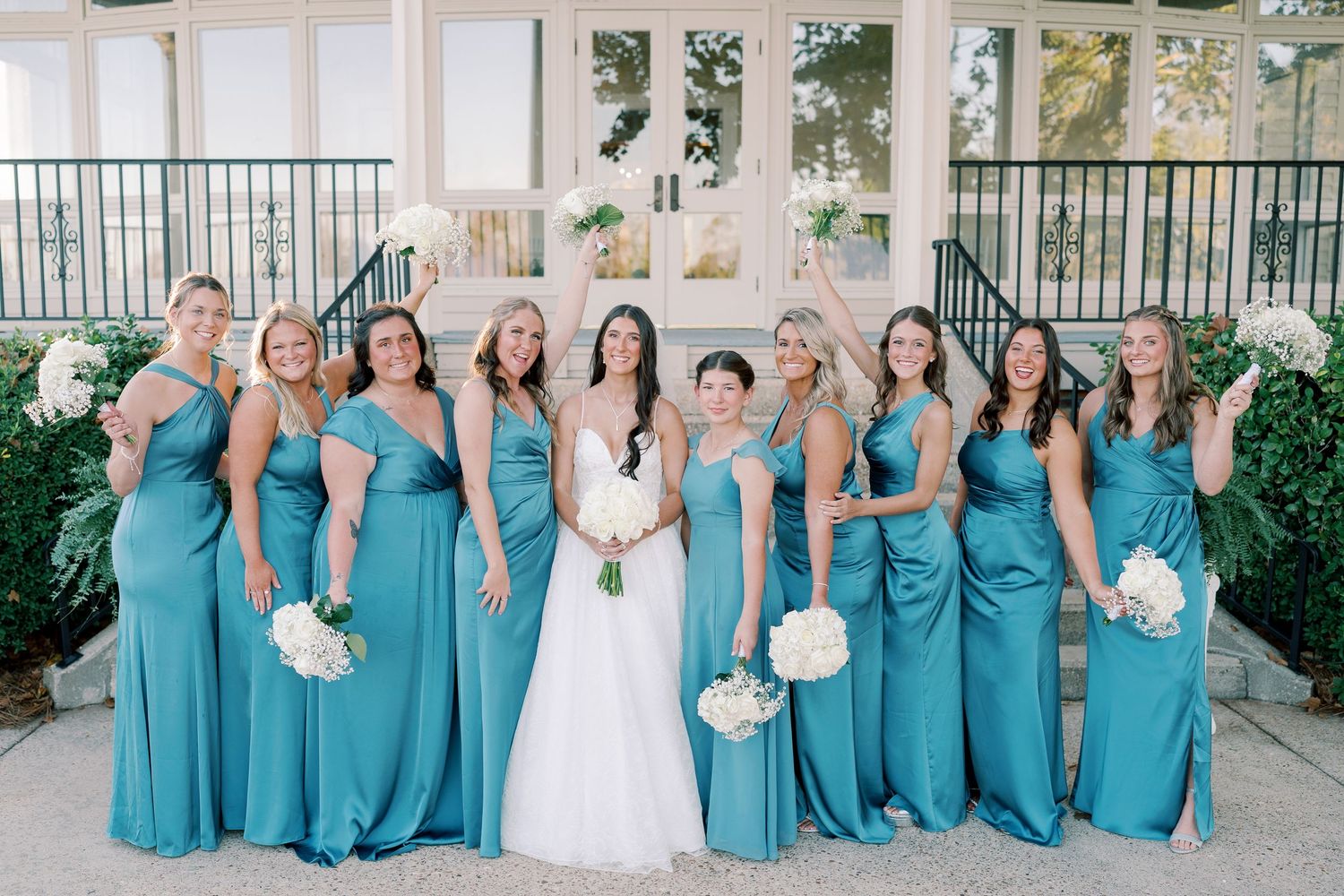 Wedding party group photos showing bridesmaids in matching turquoise dresses with white bouquets.