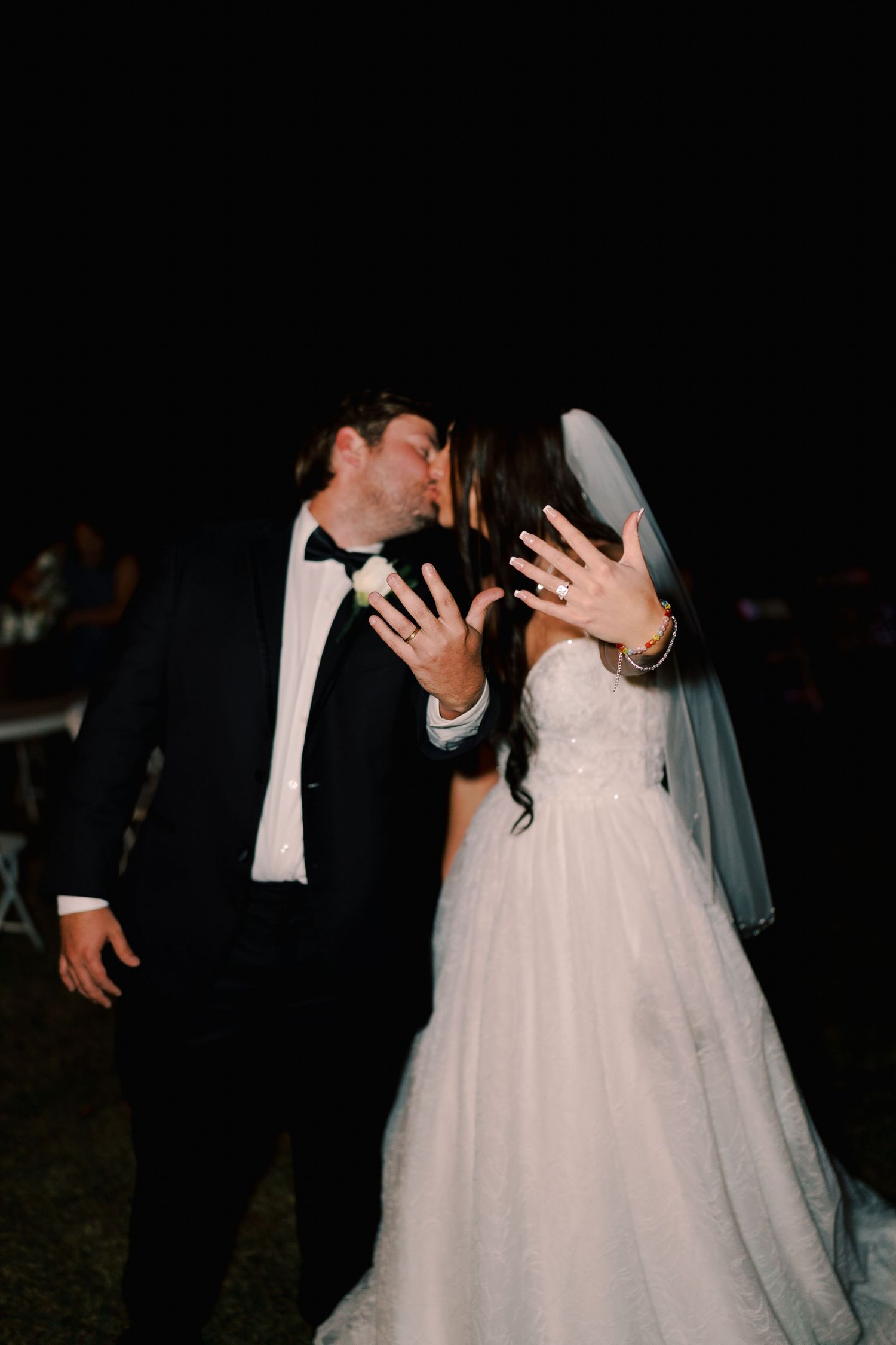 Romantic first dance sequence of newlyweds in formal attire at their wedding reception.
