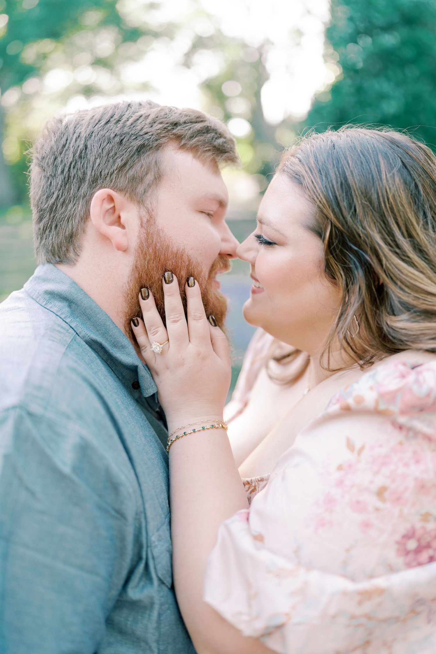 Intimate close-up shots of a couple sharing tender moments in a garden setting.