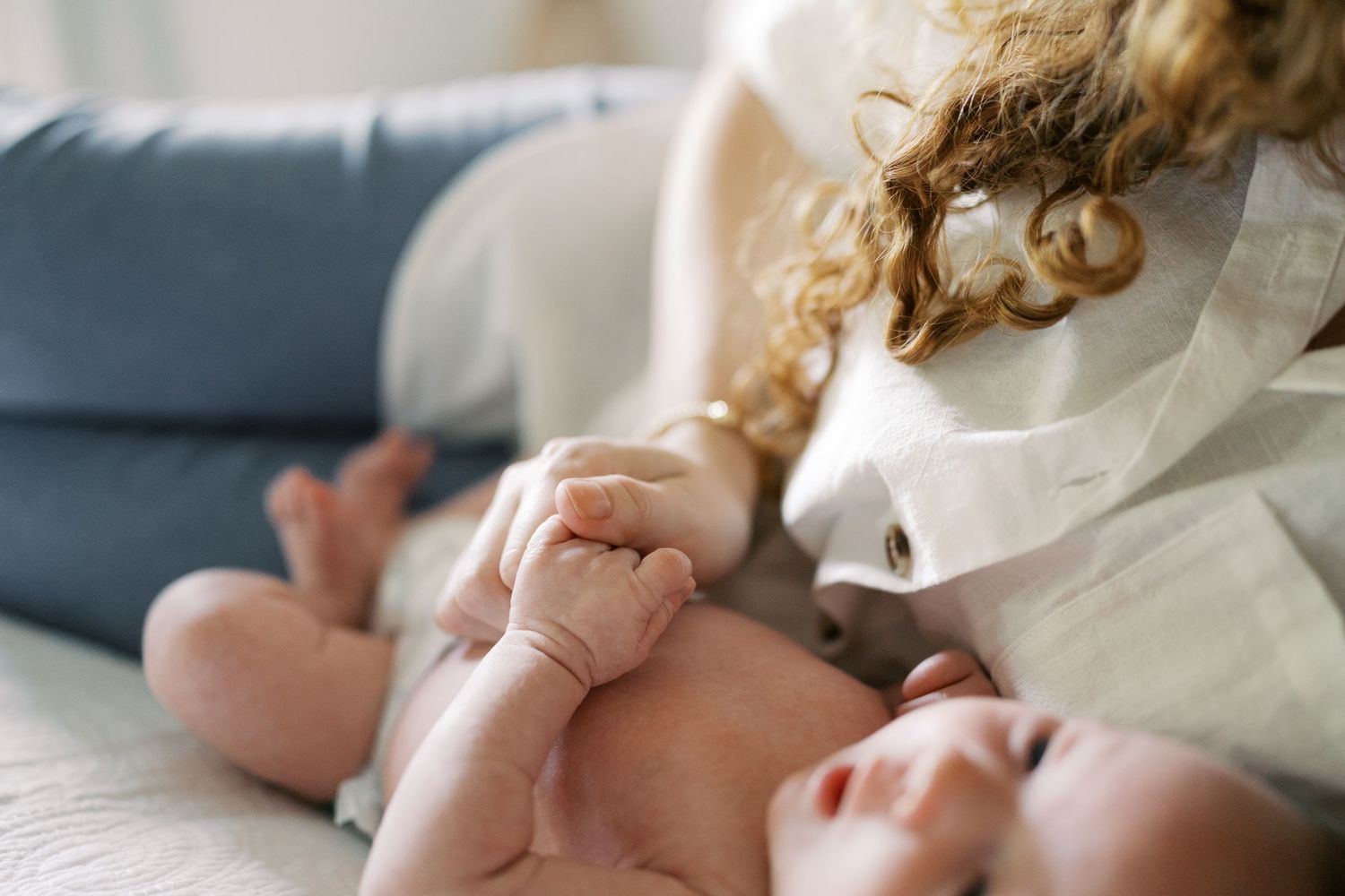 Close-up of tender family moments captured on a comfortable bed.