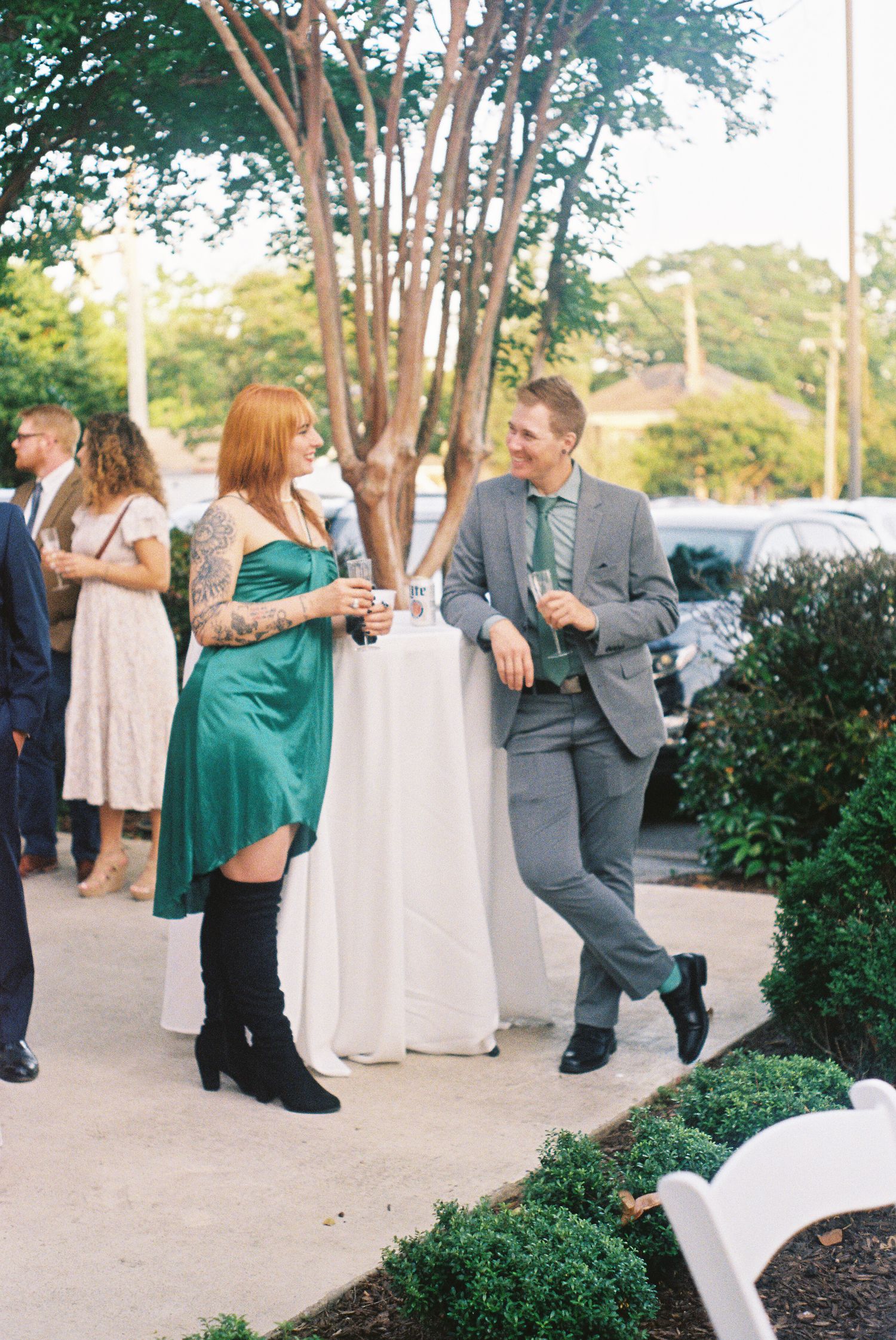 Wedding guests dancing and enjoying themselves at an outdoor reception.