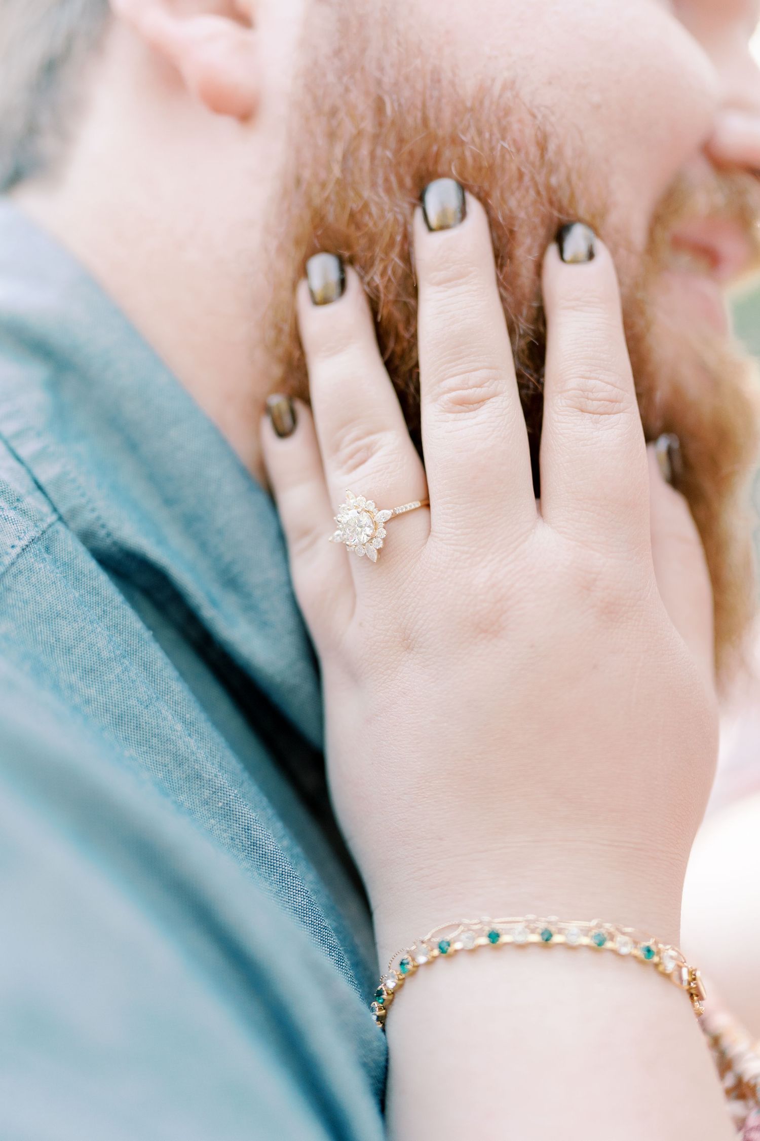 Close-up detail shots of engagement rings and jewelry against grey fabric.