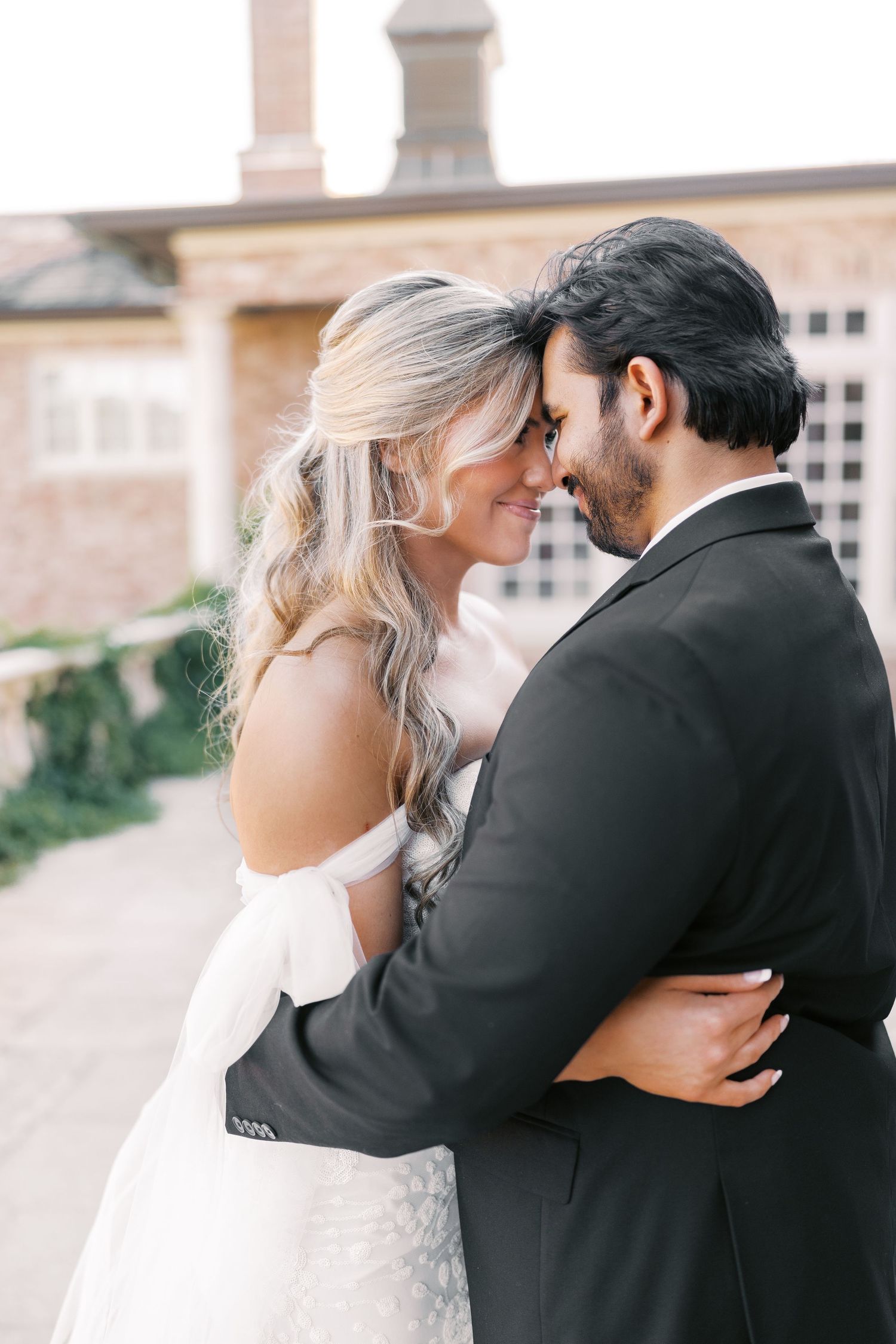 Intimate close-up moments between newlyweds in romantic outdoor setting.