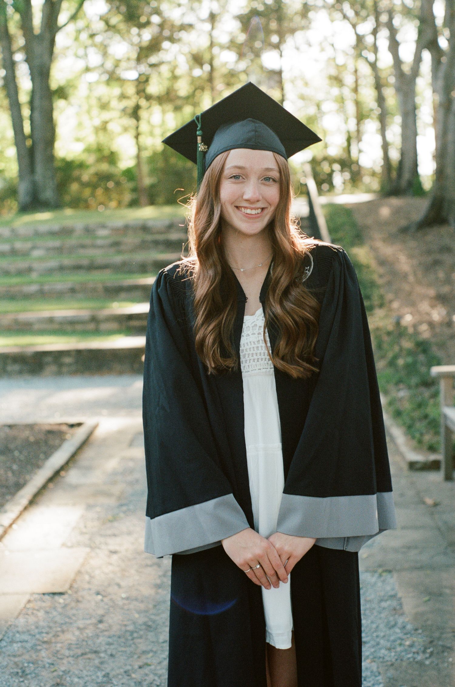 Graduation photos showing someone in traditional black cap and gown outdoors.