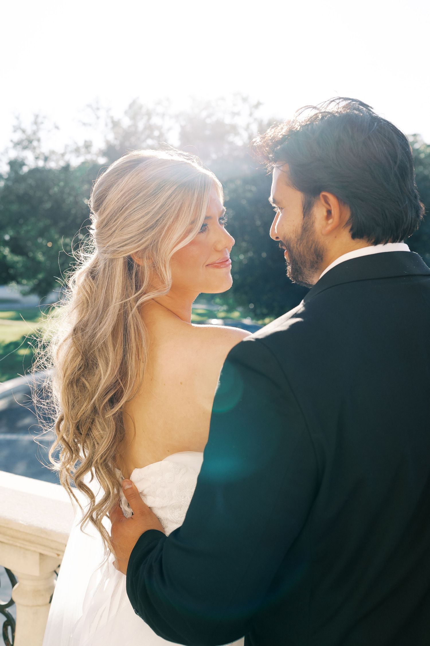 Sun-drenched wedding portraits capturing romantic moments in golden light.