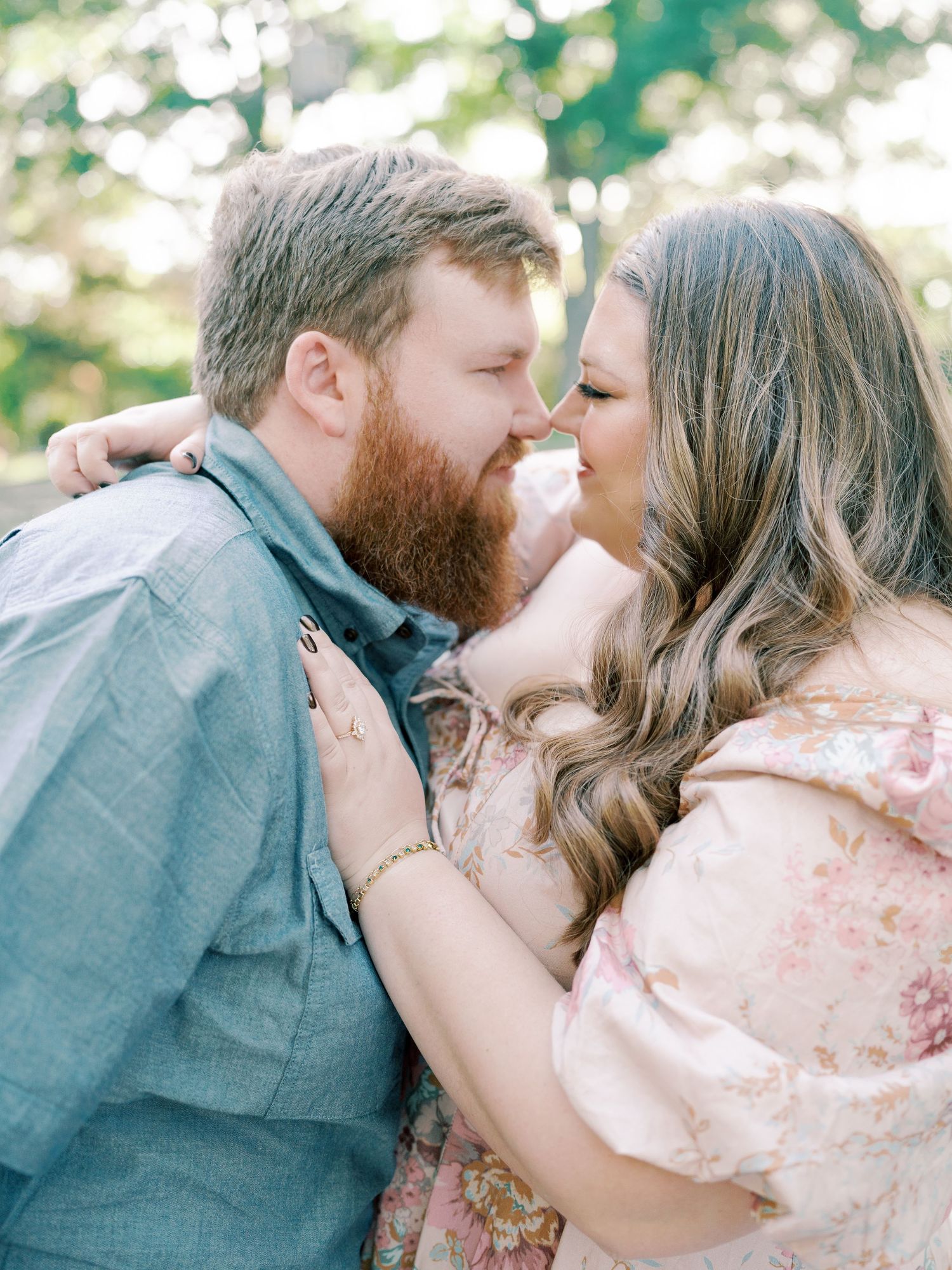 Romantic close-up shots of a couple sharing intimate moments in a garden setting.