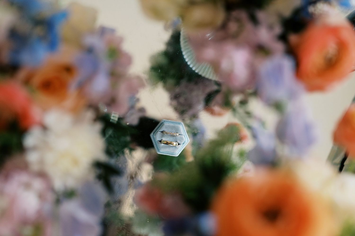 Close-up of colorful floral arrangements with peach and orange blooms.