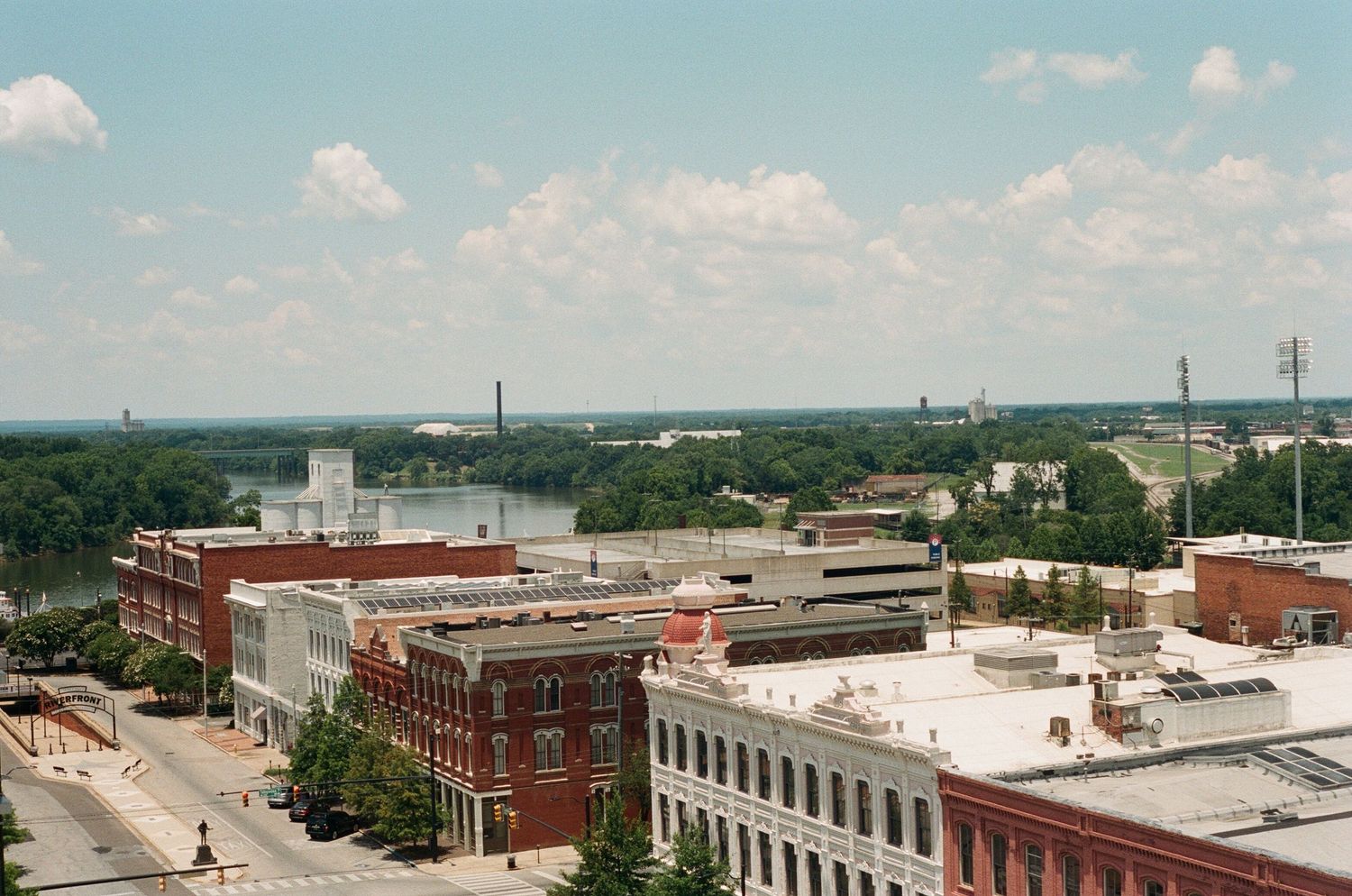 Wide cityscape view of downtown buildings and streets from an elevated perspective.