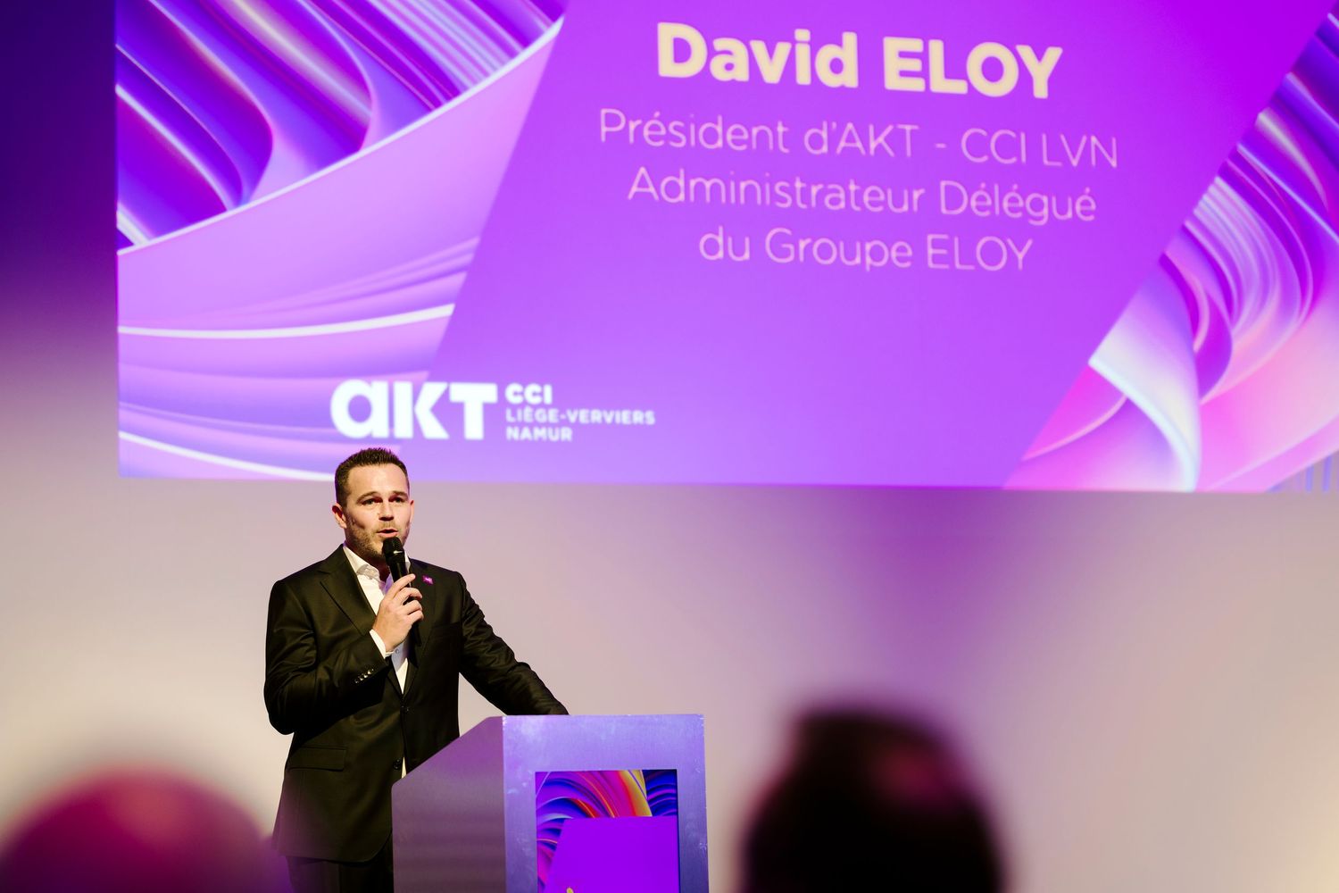 David Eloy, President of AKT CCI LVN, speaking at corporate conference presentation.