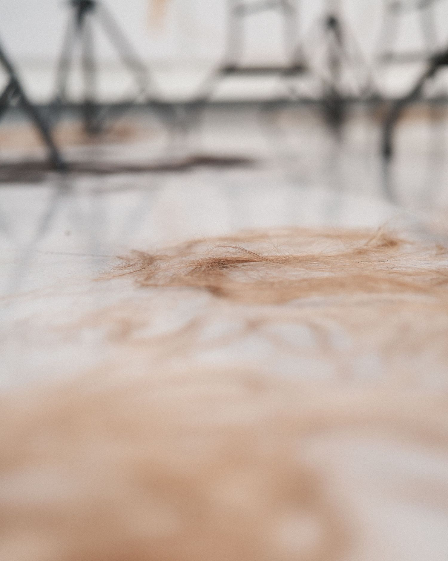 Hair clippings on the studio floor after a hands on training session photographed as event coverage