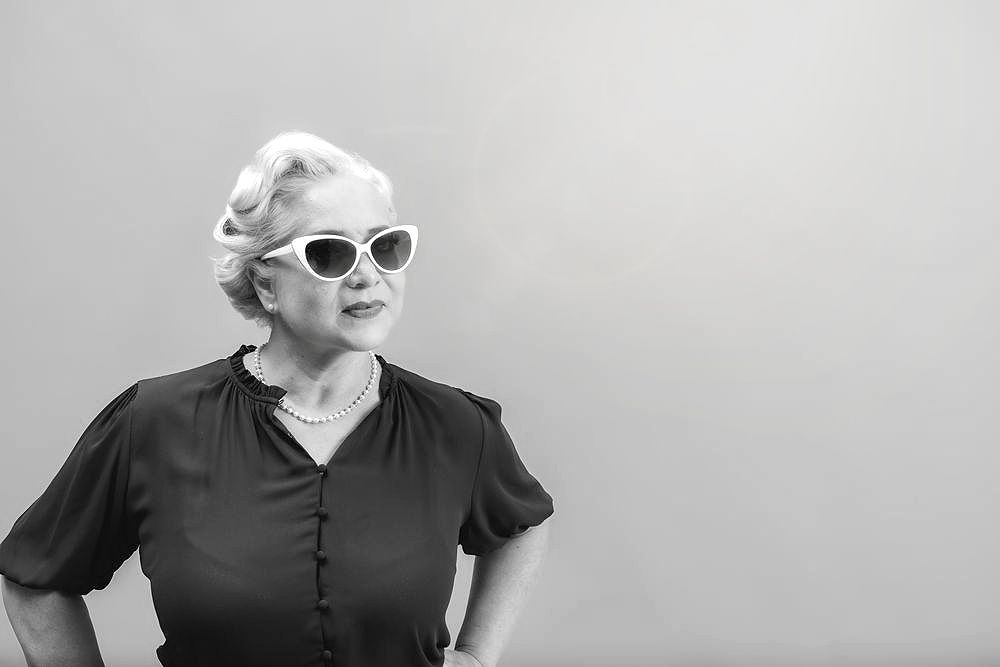 Series of black and white portraits showing casual poses and expressions.Branding photography for an inspiring model in St Charles County.