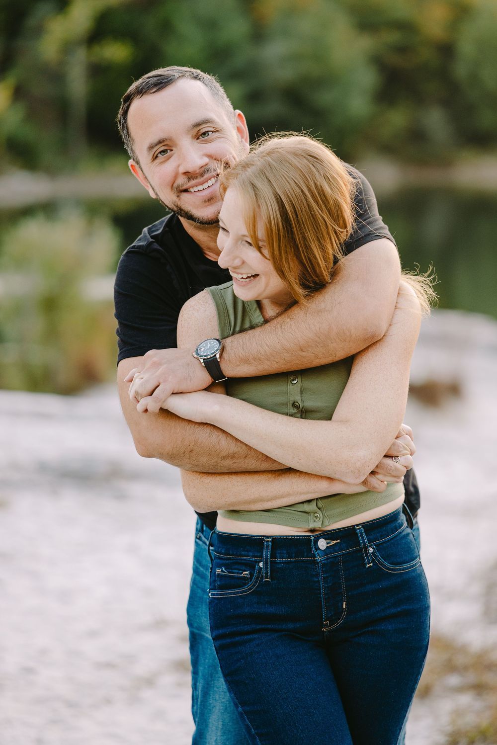 Golden hour couples portrait capturing cinematic movement and natural storytelling near lake in Saint Charles County, Missouri. Photographer