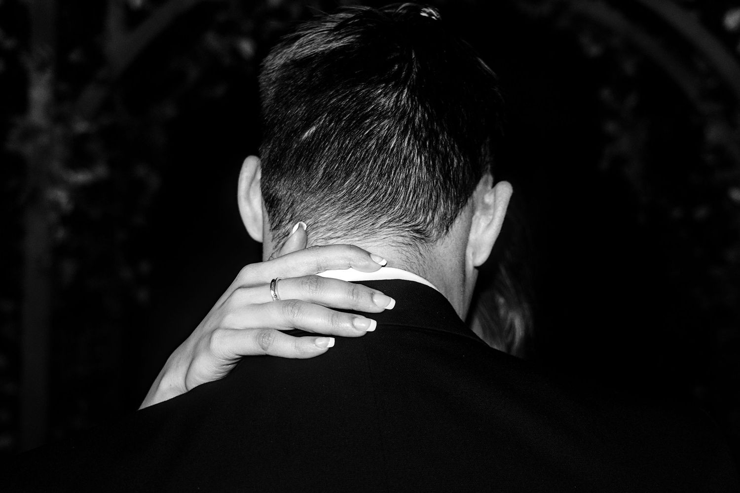 Black and white photo of couples dancing together at an elegant evening event.