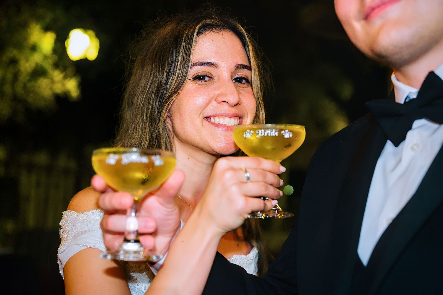 Wedding guests enjoying cocktails and champagne at an elegant reception.