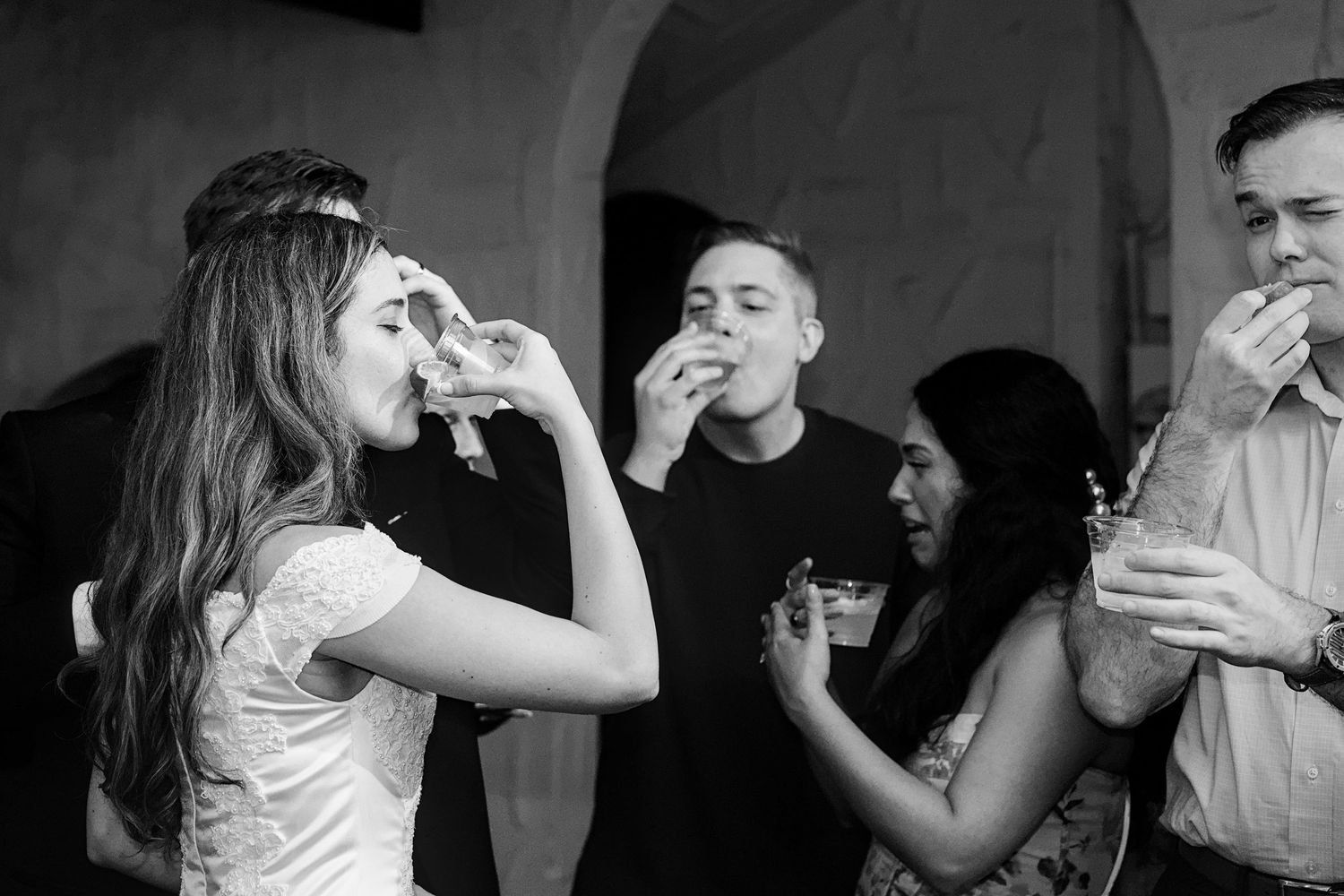 Black and white series of candid reception moments showing dancing and celebration.