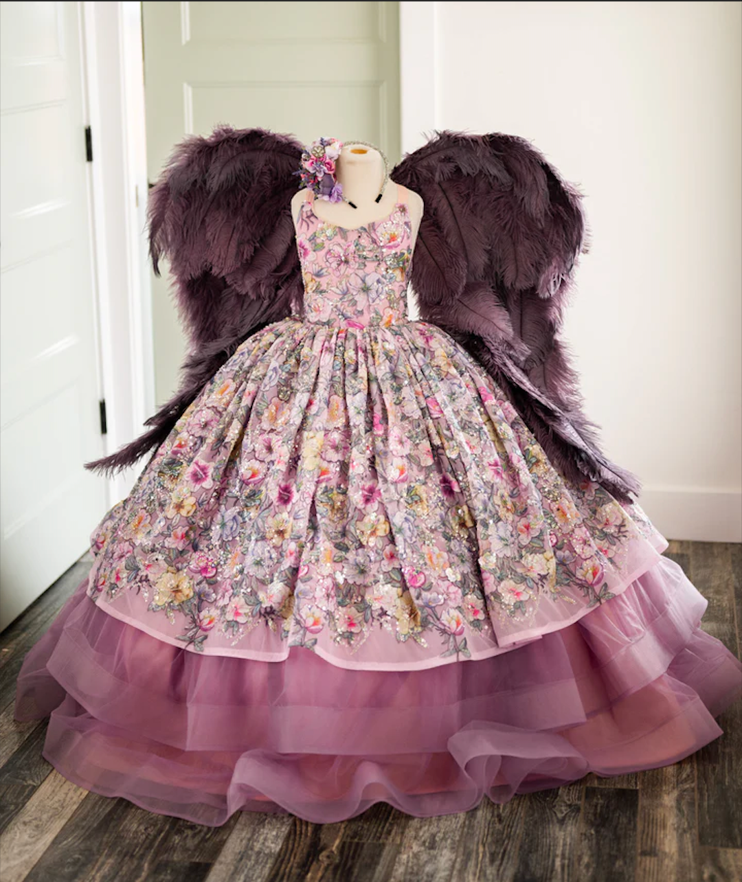Vintage-style floral dress with purple tulle underskirt displayed on mannequin.