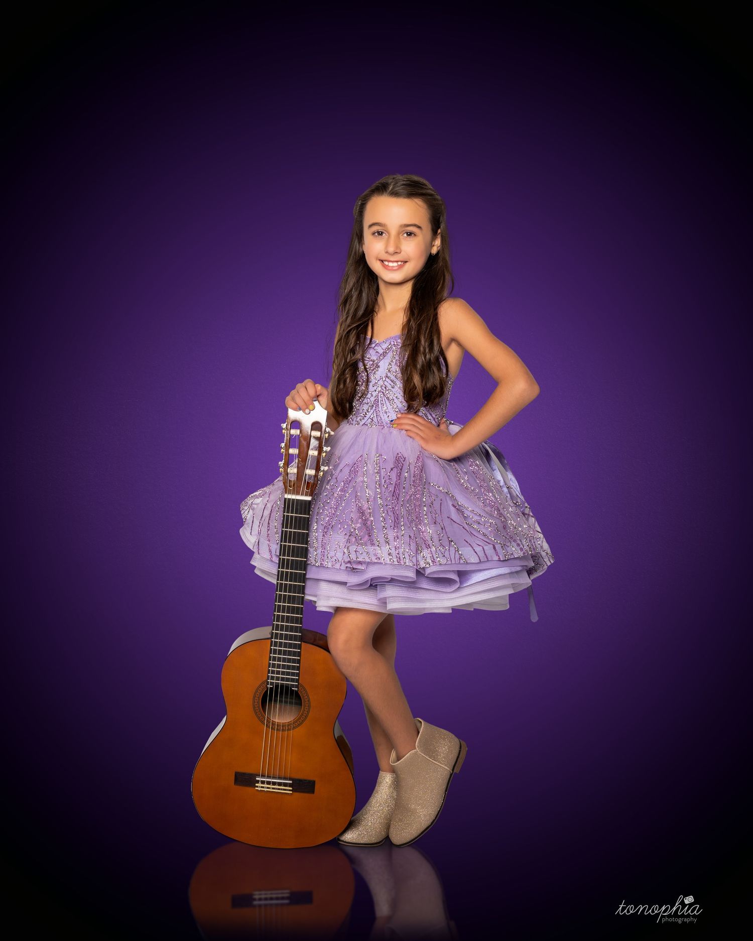 Dynamic poses with a classical guitar in a purple-lit studio setting.