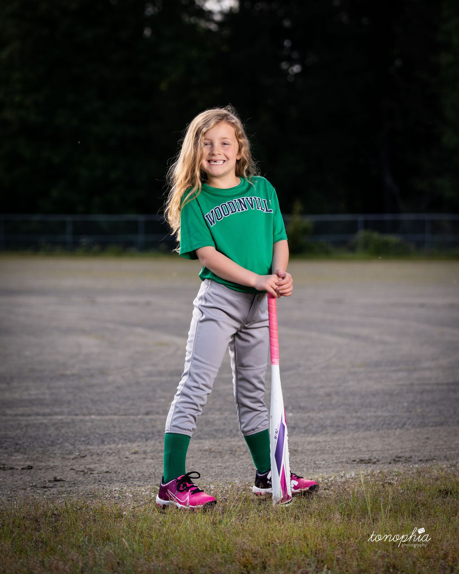 A series of connected photos shows a softball player in green and gray practicing batting stances on a field.