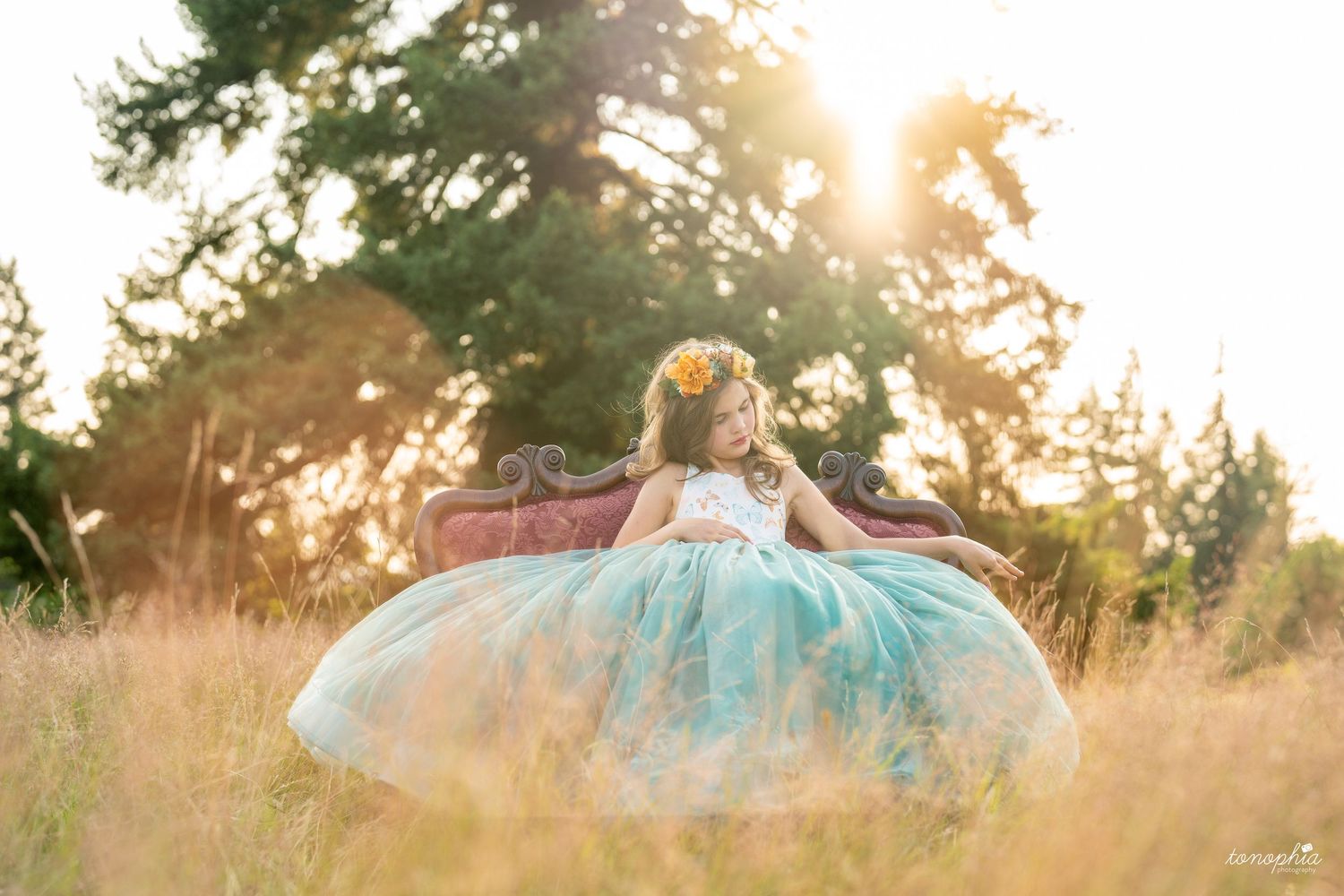 Ethereal outdoor photography featuring flowing dresses backlit by warm evening sun.
