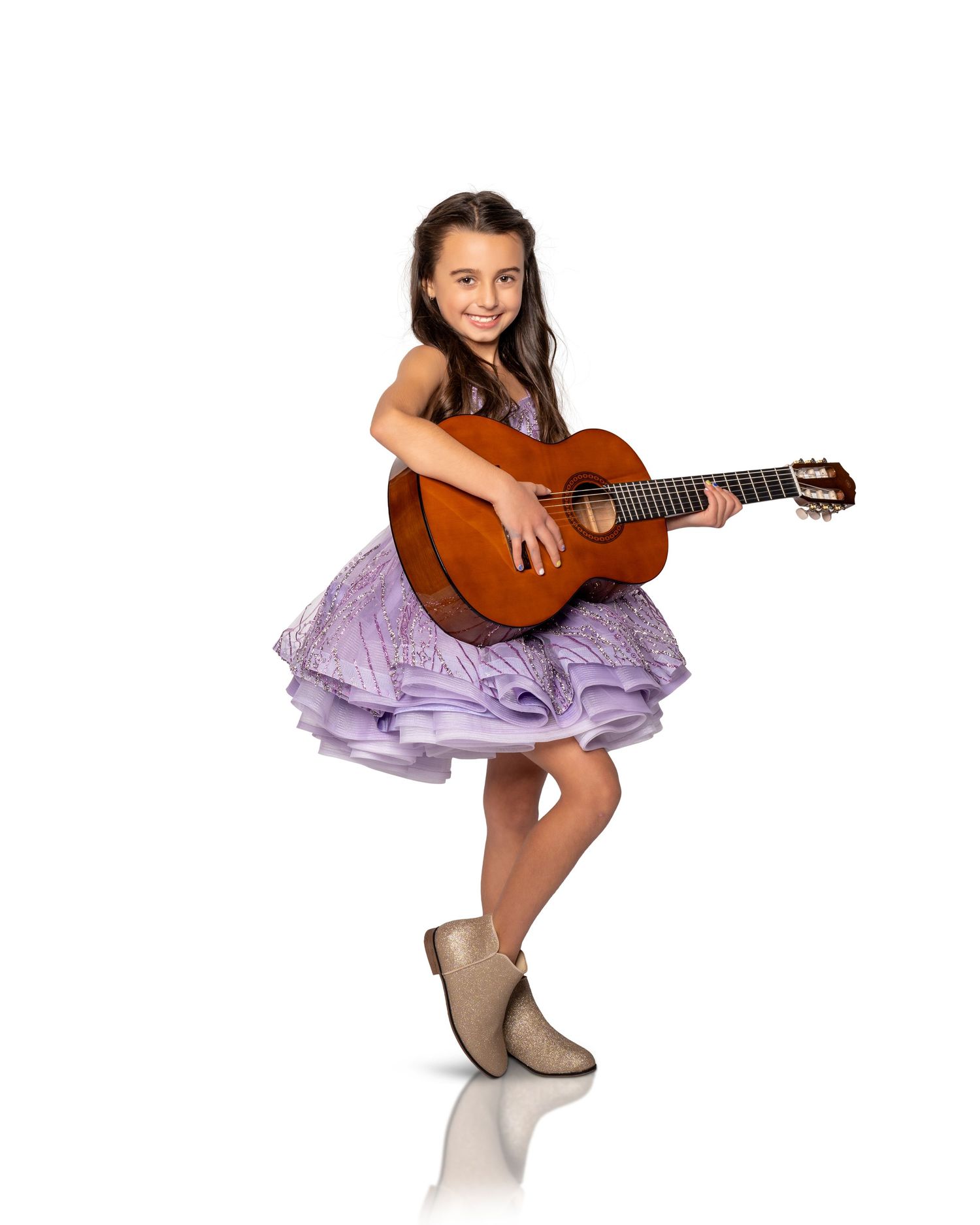 Studio portraits featuring a classical guitar and lavender tulle dress on white background.