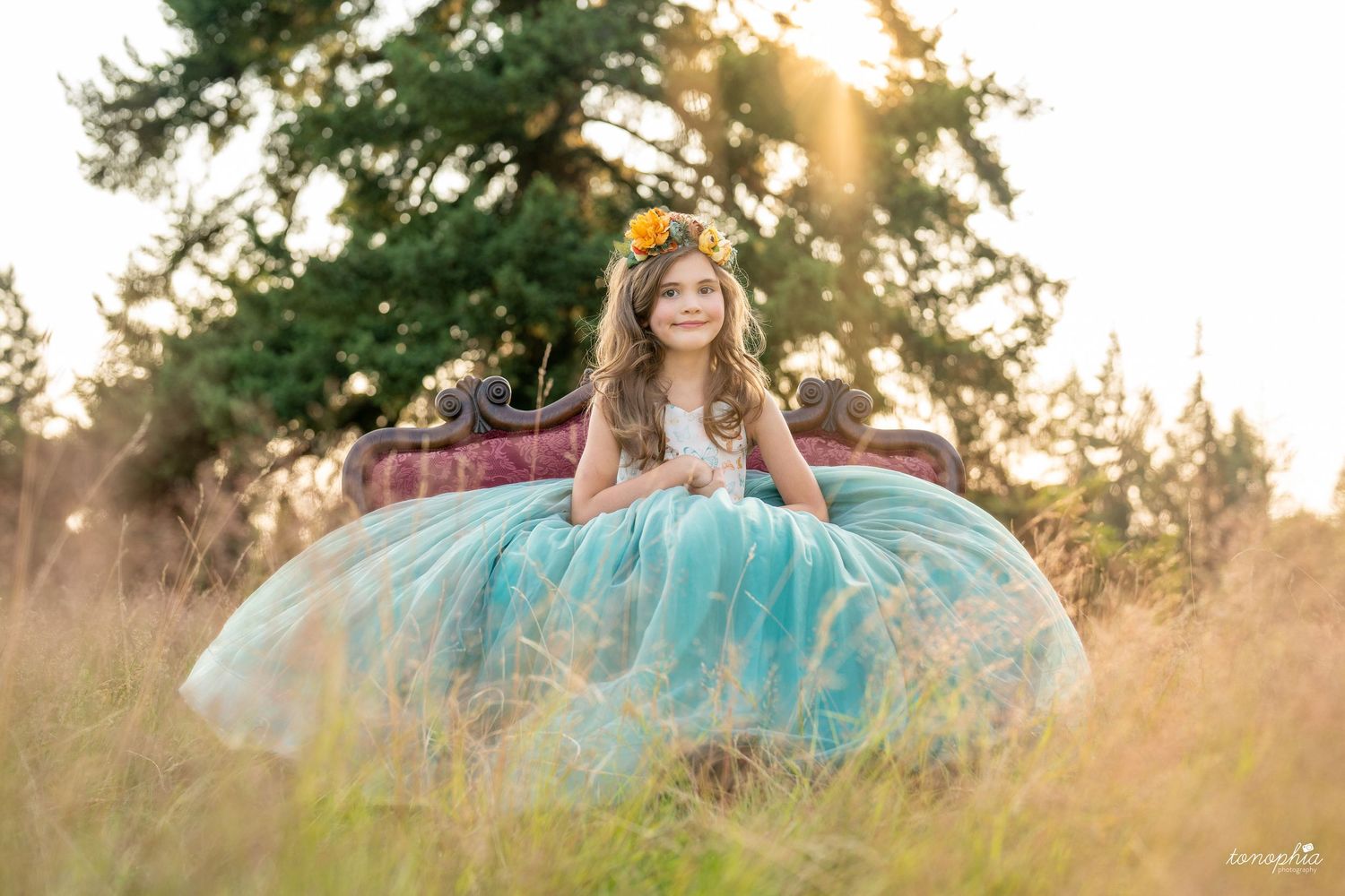 Dreamy outdoor portrait session with flowing gowns in golden evening light.