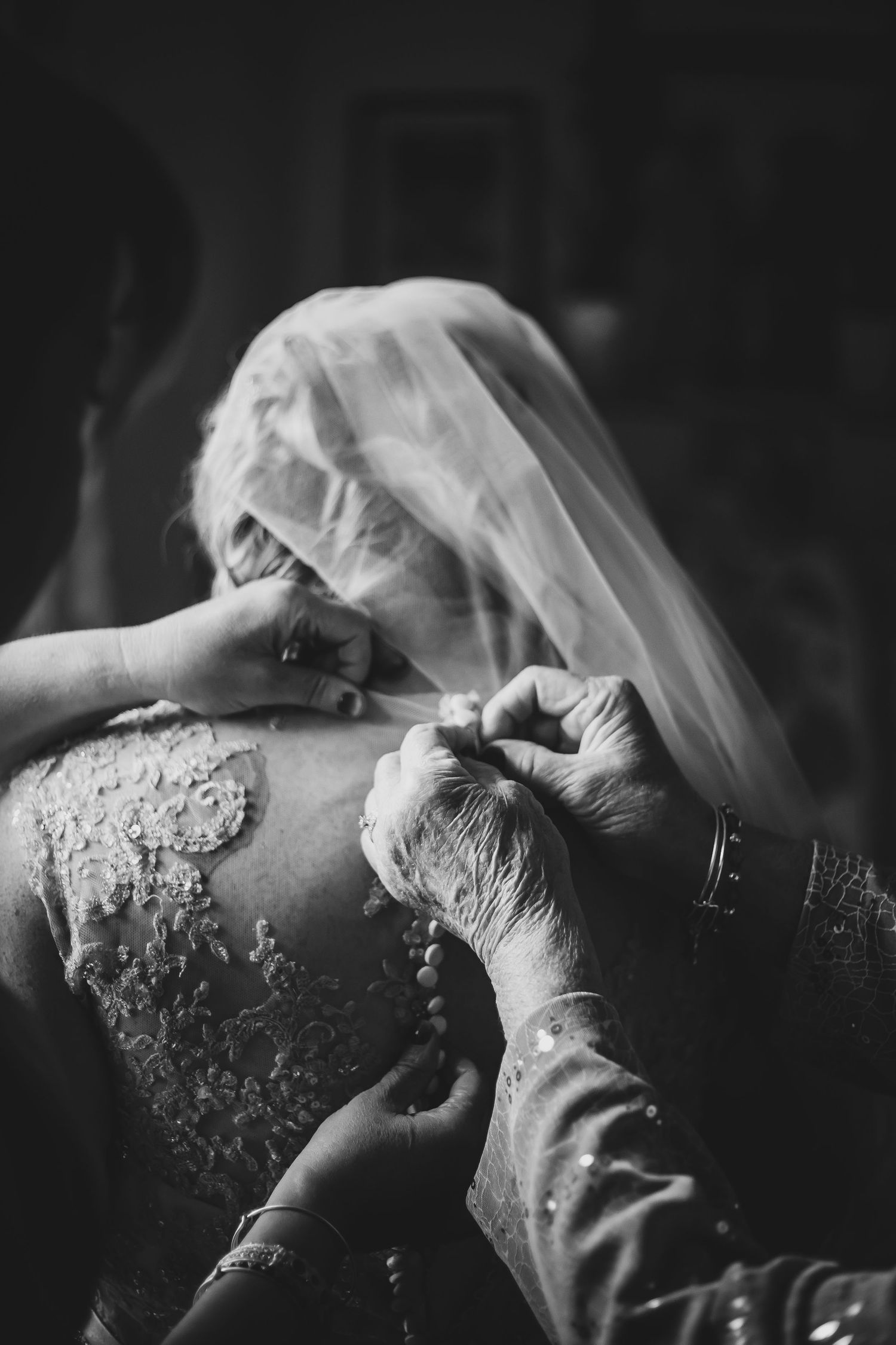 A black and white artistic sequence of intimate wedding moments captured in soft focus and romantic lighting.