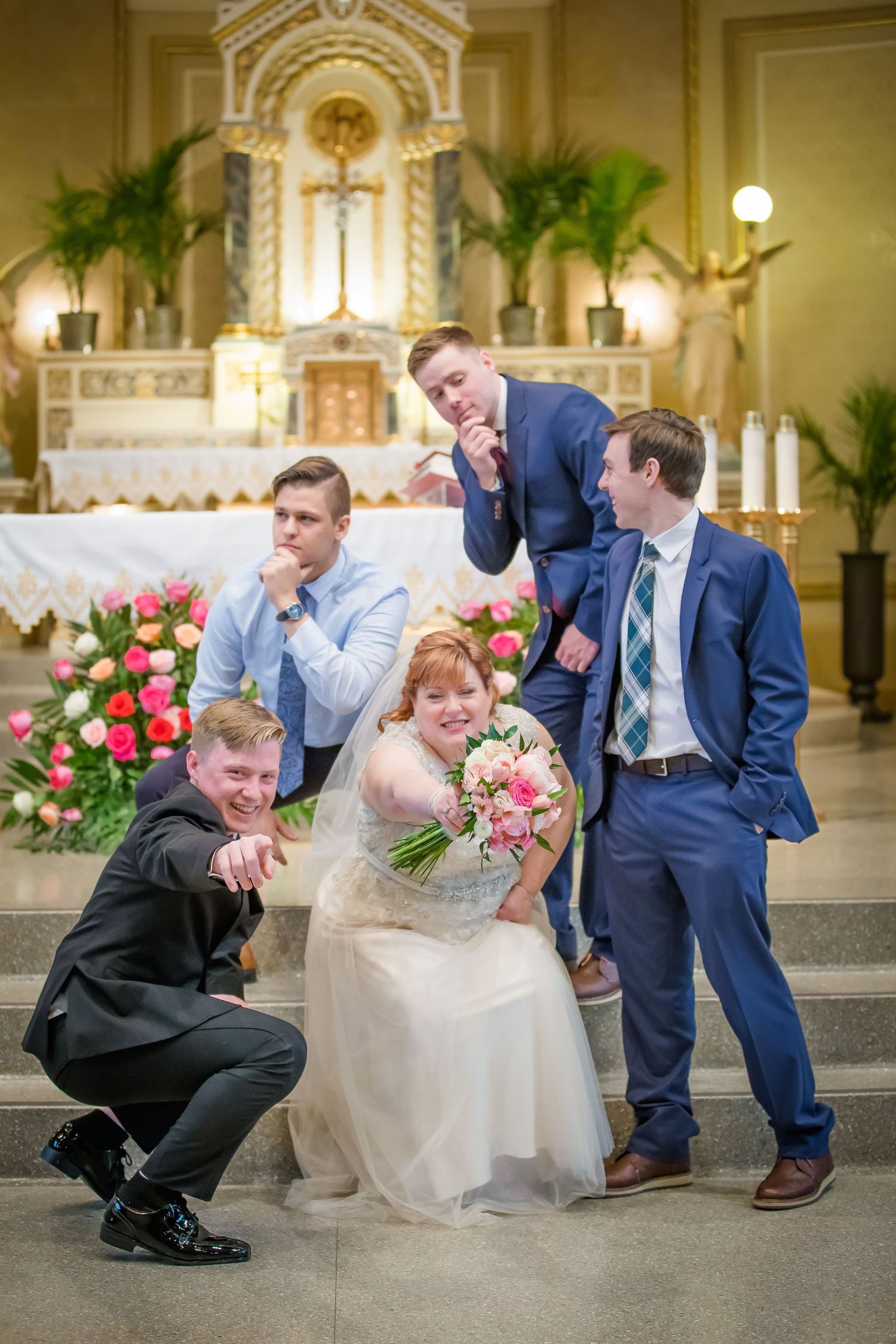 A series of playful wedding party photos showing groomsmen in navy suits posing together in a church setting.