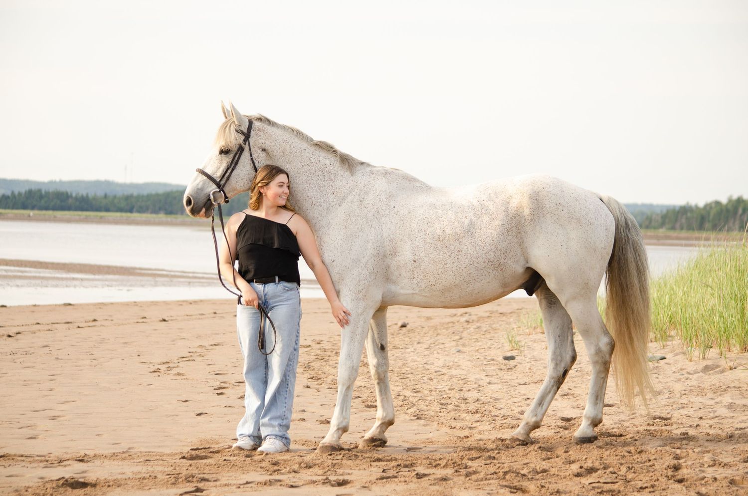 girl smiling with horse
