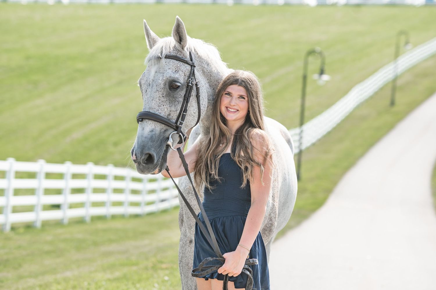 girl smiling with horse