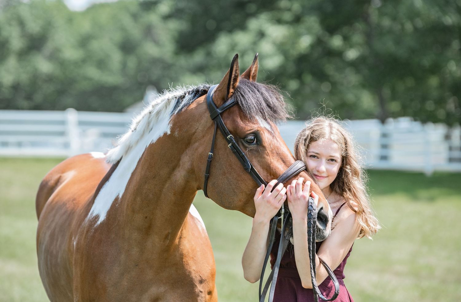 girl smiling with horse