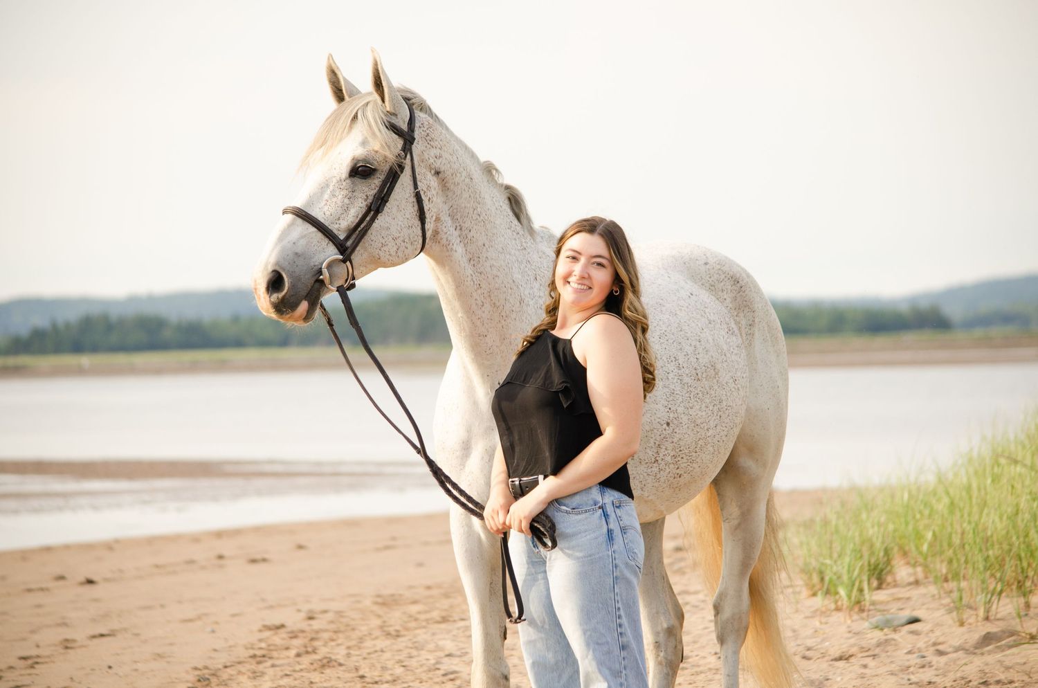 girl smiling with horse